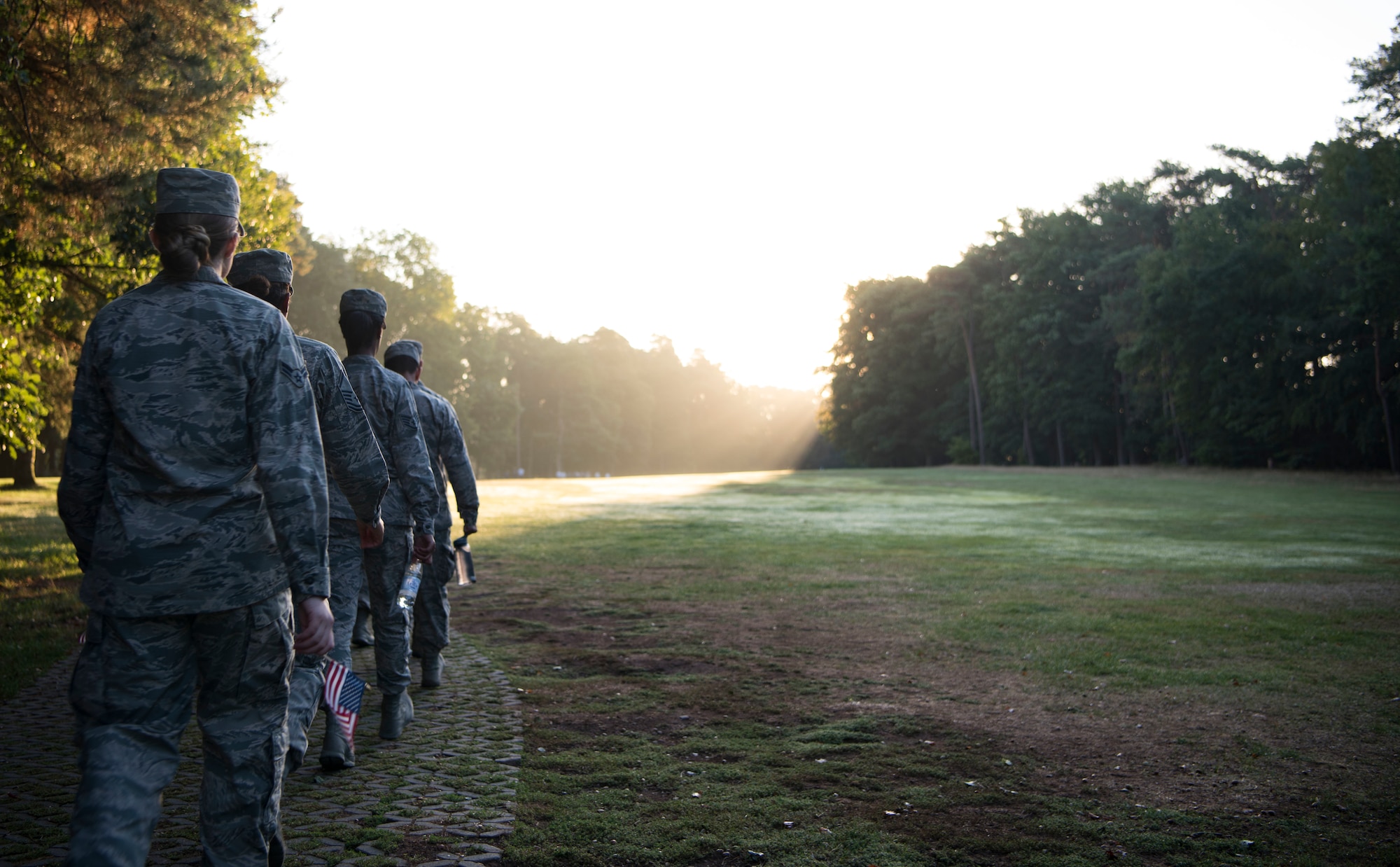 U.S. Air Force Airmen march through a golf course on Ramstein Air Base, Germany, Sep. 11, 2018, in remembrance of the wounded and fallen brothers and sisters in arms and the victims on 9/11 on As individuals made their way through the course, they read 18 different graphics which commemorated 18 different heroes in our military who acted selflessly in times of extreme duress.