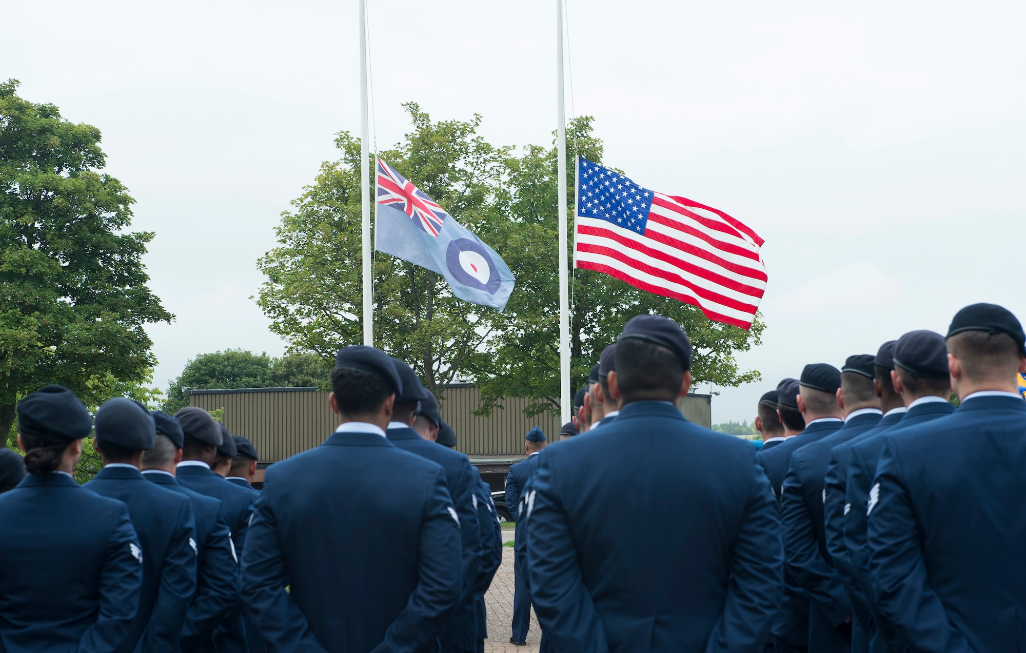 Airmen from the 423rd Security Forces Squadron stand in honor of Sept. 11 at RAF Croughton, United Kingdom, Sept. 11, 2018. RAF Croughton payed respects by holding a retreat ceremony and speech. (U.S. Air Force photo by Senior Airman Chase Sousa)