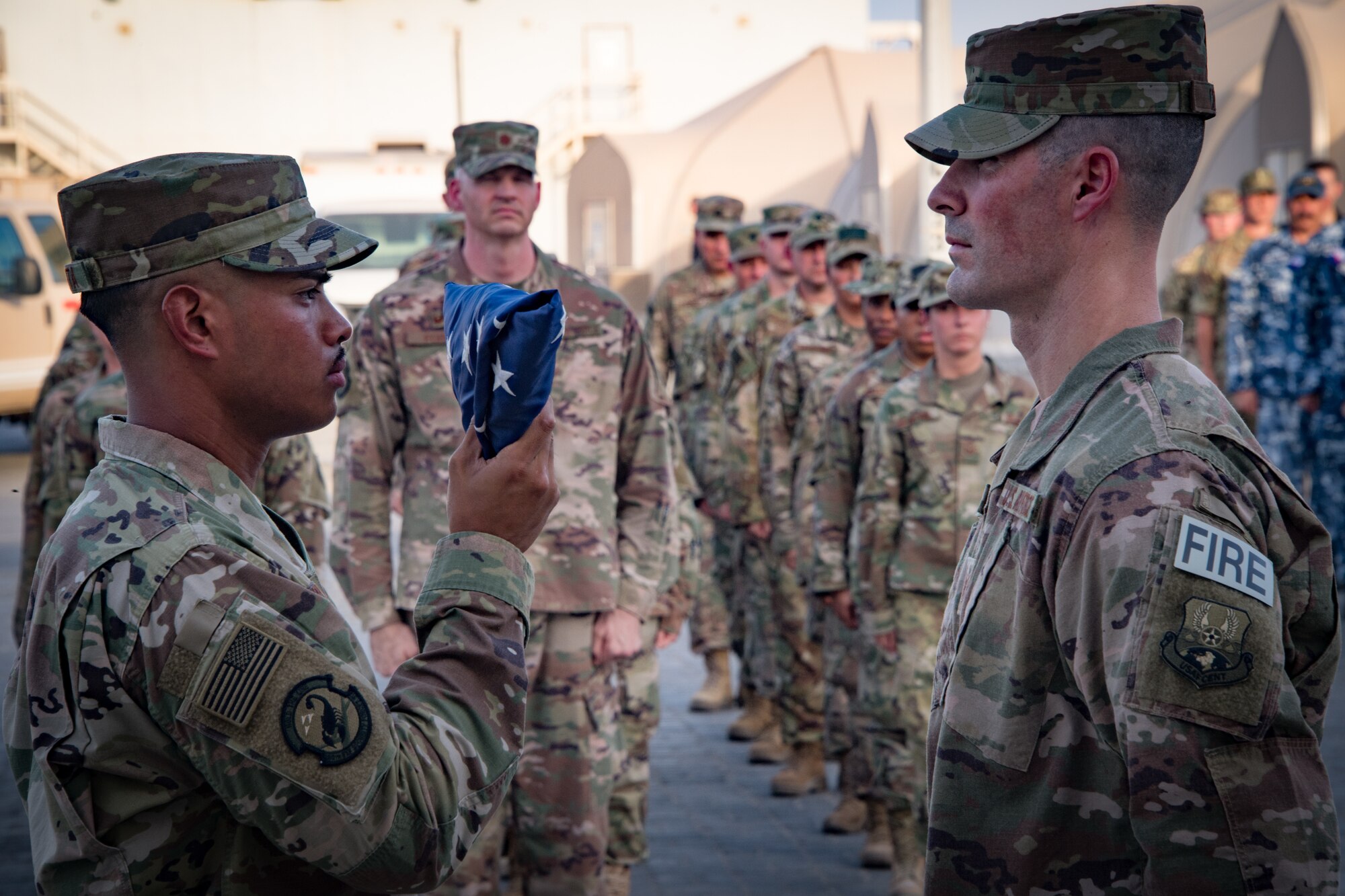 U.S. Airmen, Soldiers and coalition partners from the from the 380th Air Expeditionary Wing honored first responders who died in the line of duty during the terrorist attack on the World Trade Center during a retreat ceremony at Al Dhafra Air Base, United Arab Emirates, Sept. 11, 2018.  (U.S. Air Force photo by Tech. Sgt. Nieko Carzis)