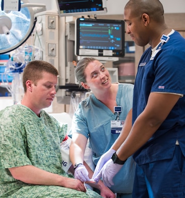 Maj. Penny Glenn (center), a critical care nurse with the 190th Medical Group and education specialist with The University of Kansas Health System (TUKHS), trains a guard member during a clinical rotation at TUKHS, June 20, 2017. The 190th Medical Group, part of the 190th Kansas Air National Guard Air Refueling Wing, has an established partnership with TUKHS to ensure Airmen maintain their clinical currency to deliver care downrange. (Courtesy photo)