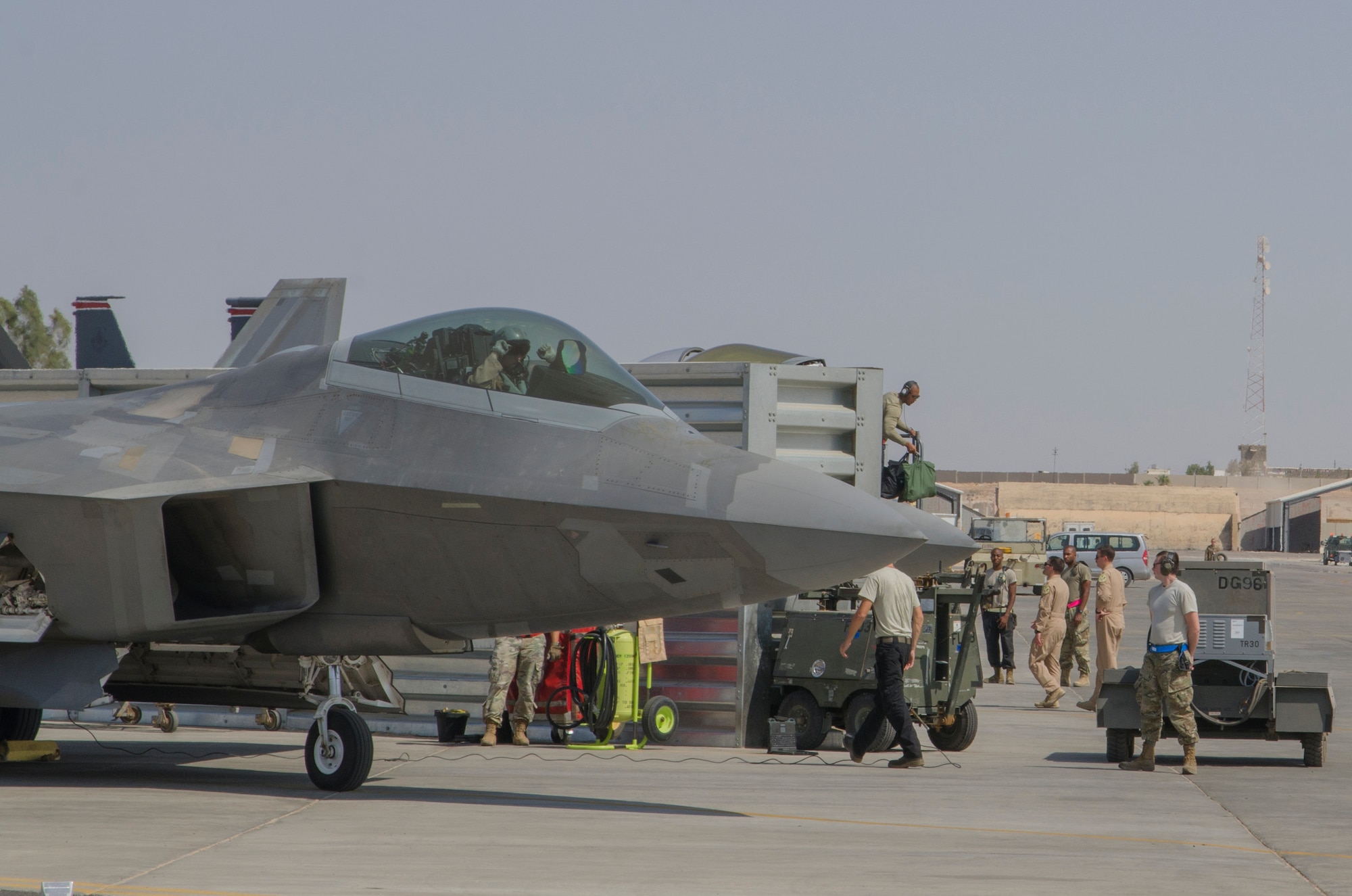 Airmen recover an F-22 Raptor in Southwest Asia.