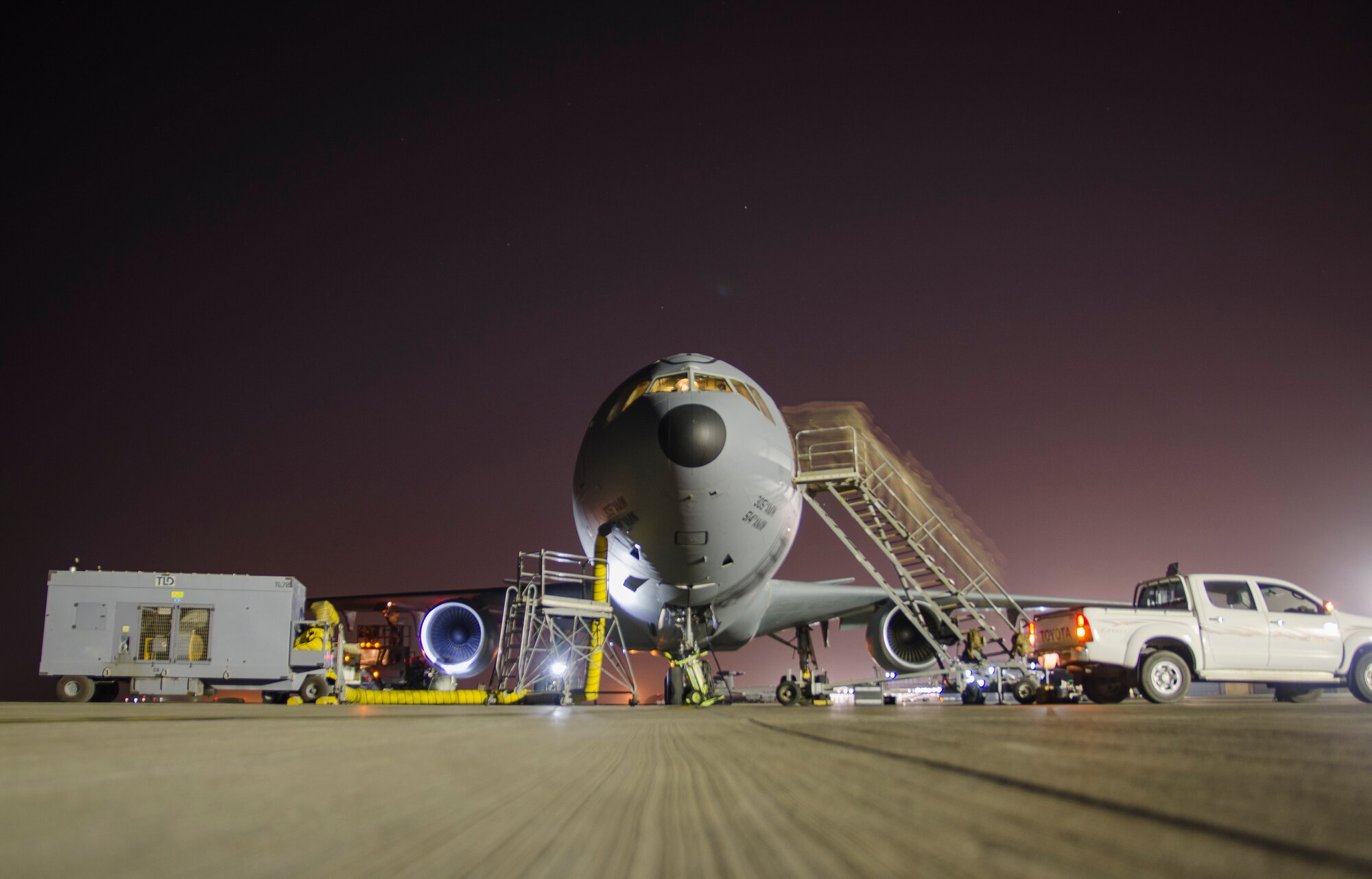 A KC-10 is parked on a flighline in Southwest Asia.