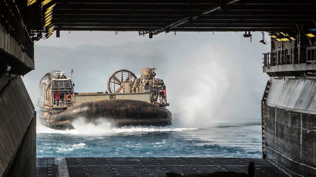 A landing craft, air cushion lands aboard the Wasp-class amphibious assault ship USS Essex during the Theater Amphibious Combat Rehearsal. Led by Naval Amphibious Force, Task Force 51/5th Marine Expeditionary Expedition Brigade, TACR integrates U.S. Navy and Marine Corps assets to practice and rehearse a range of critical combat-related capabilities available to U.S. Central Command, both afloat and ashore, to promote stability and security in the region. U.S. 5th Fleet and coalition assets are participating in numerous simultaneous exercises as part of the greater Theater Counter Mine and Maritime Security Exercise to ensure maritime stability and security in the U.S. Central Command area of responsibility, connecting the Mediterranean and the Pacific through the western Indian Ocean and three strategic choke points.