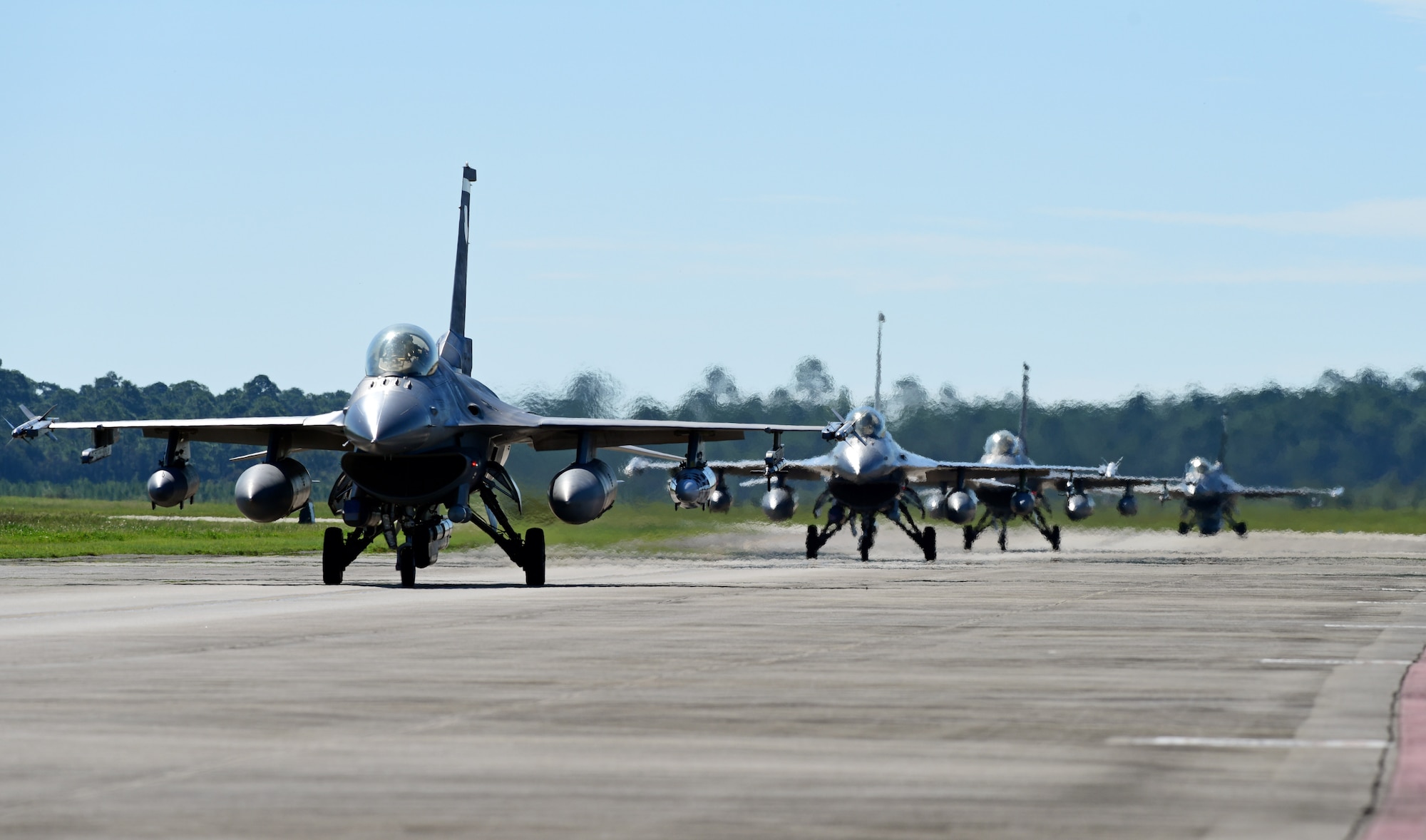 U.S. Air Force F-16 Fighting Falcons from the 20th Fighter Wing, Shaw Air Force Base, S.C., taxi upon landing at Tyndall Air Force Base, Fla., Sept. 12, 2018. The wing sent its aircraft to Tyndall to escape the potentially destructive path of Hurricane Florence. (U.S. Air Force photo by Senior Airman Isaiah J. Soliz)