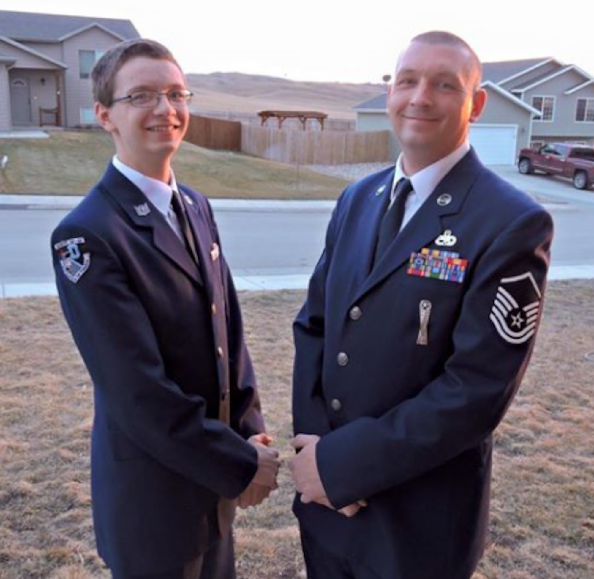 Master Sgt. Nicholas Hovingh, the 37th Aircraft Maintenance Unit noncommissioned officer in charge of weapons loading, and his son, James, stand in uniform together in Box Elder, S.D., in 2017. James took his oath of enlistment at the Central States Fair in Rapid City in front of thousands of people on Aug. 23, 2018, to serve on active duty with his father. (Courtesy photo)