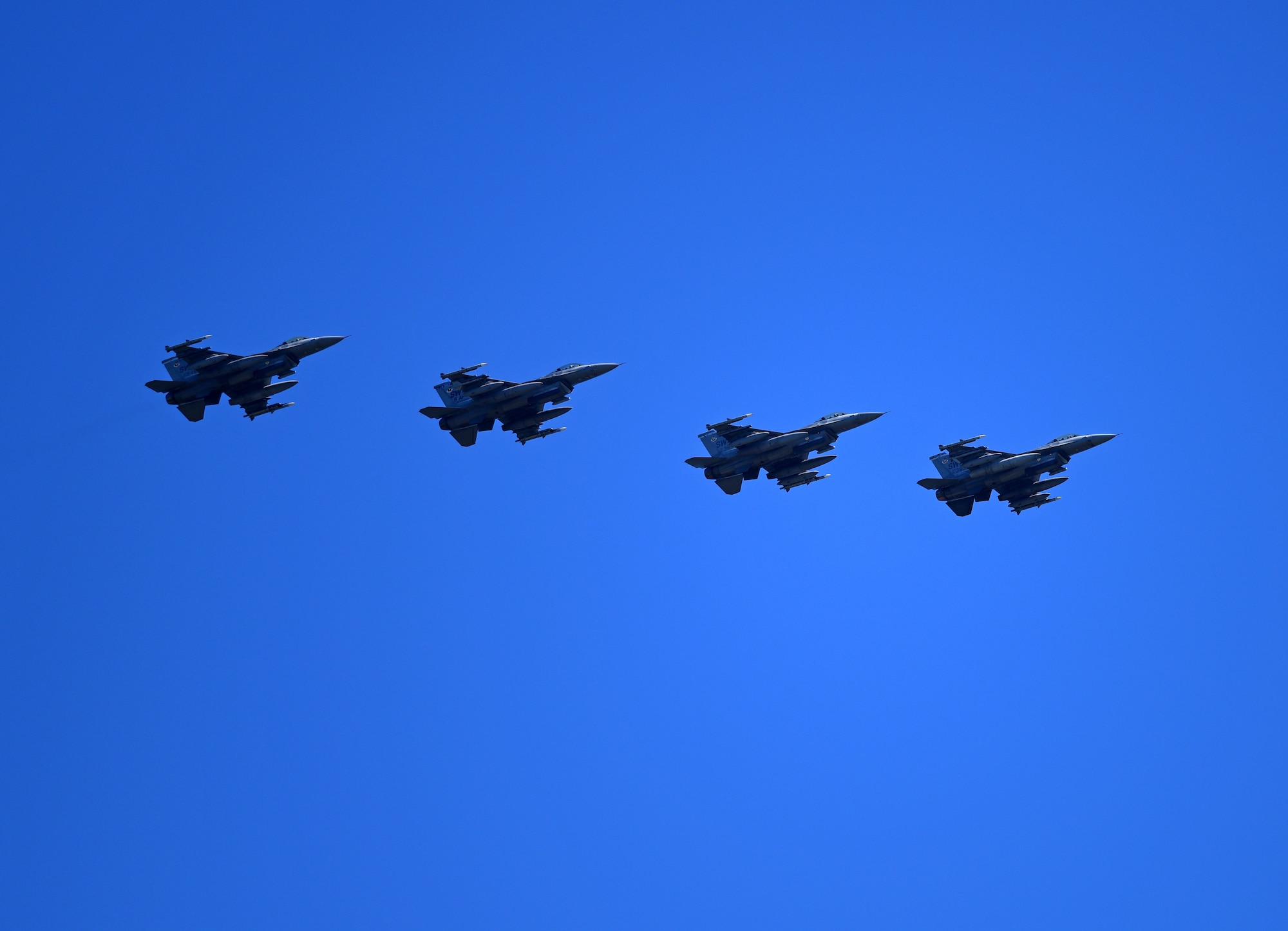 U.S. Air Force F-16 Fighting Falcons from the 20th Fighter Wing, Shaw Air Force Base, S.C., fly in formation over the flightline at Tyndall Air Force Base, Fla., Sept. 12, 2018. Shaw sent aircraft from both the 77th and the 79th Fighter Squadrons to Tyndall to escape the path of Hurricane Florence. (U.S. Air Force photo by Senior Airman Isaiah J. Soliz)