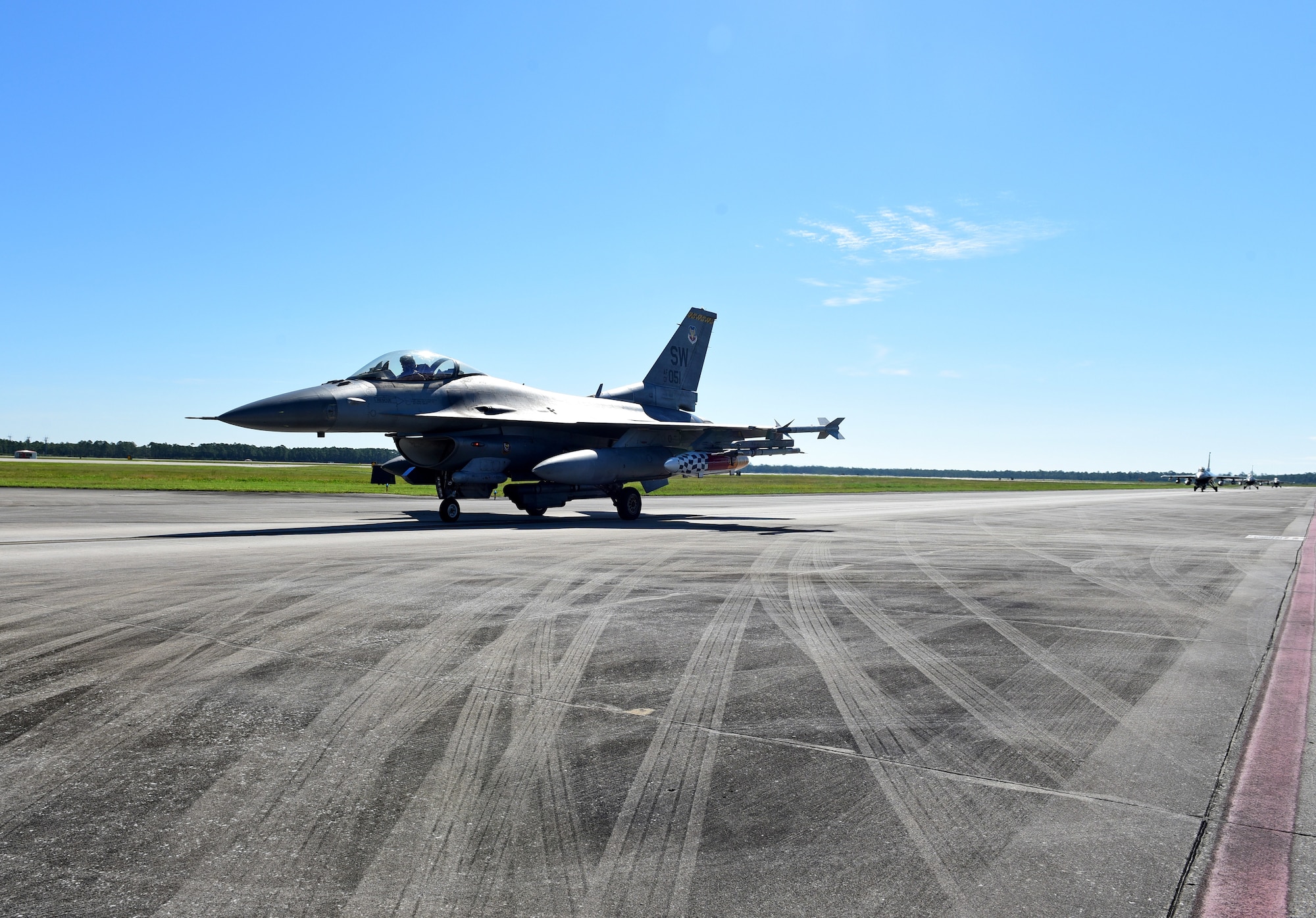 U.S. Air Force F-16 Fighting Falcons from the 20th Fighter Wing, Shaw Air Force Base, S.C., taxi on the flightline at Tyndall Air Force Base, Fla., Sept. 12, 2018. Shaw sent aircraft from both the 77th and the 79th Fighter Squadrons to Tyndall to escape the path of Hurricane Florence. (U.S. Air Force photo by Senior Airman Isaiah J. Soliz)