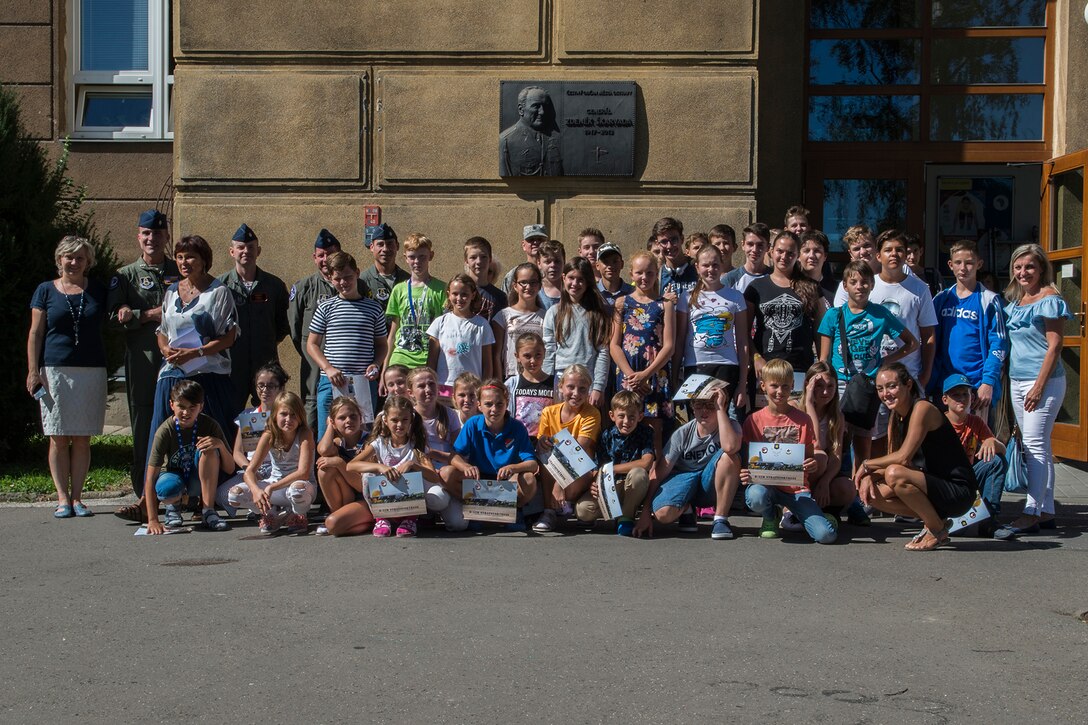 A U.S. Air Force Reserve aircrew assigned to the 307th Bomb Wing at Barksdale Air Force Base, La., takes a photo with students at the General Zdenek Skarvada elementary school on Sept. 12, 2018, Ostrava, Czech Republic. The Airmen in Ostrava to support the NATO Days airshow, which consists of the presentation of heavy military hardware, police and rescue equipment, dynamic displays of Special Forces training, flying displays, and presentation of armaments, equipment and military gear. (U.S. Air Force photo by Master Sgt. Greg Steele)