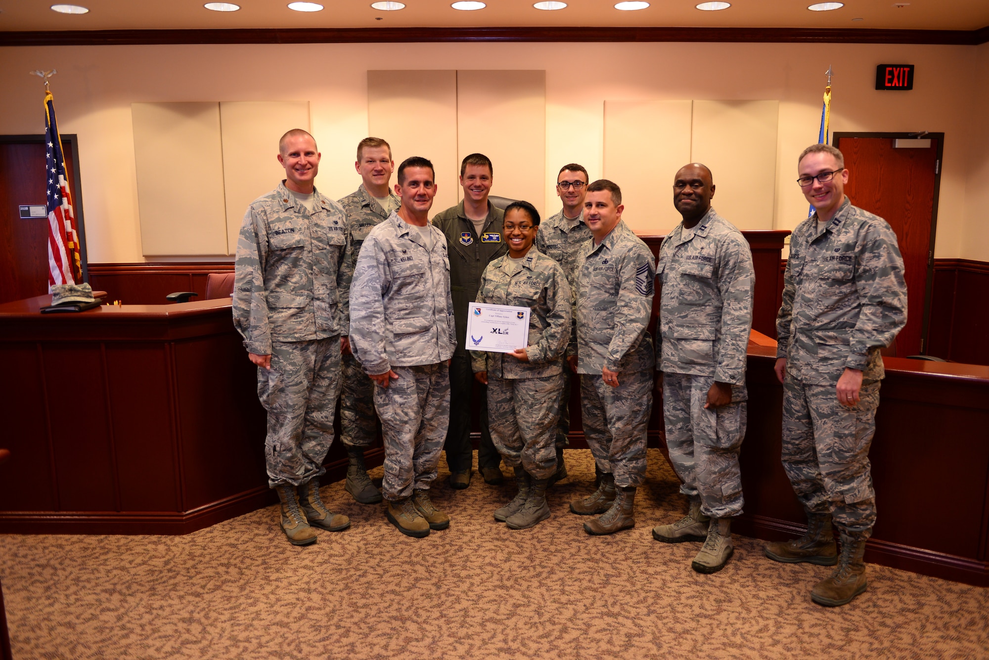 Capt. Tiffany Sykes, 47th Flying Training Wing assistant staff judge advocate, was chosen by wing leadership to be the “XLer” of the week, for the week of Sept. 4, 2018, at Laughlin Air Force Base, Texas. The “XLer” award, presented by Col. Charlie Velino, 47th Flying Training Wing commander, is given to those who consistently make outstanding contributions to their unit and the Laughlin mission. (U.S. Air Force photo by Senior Airman Benjamin N. Valmoja)