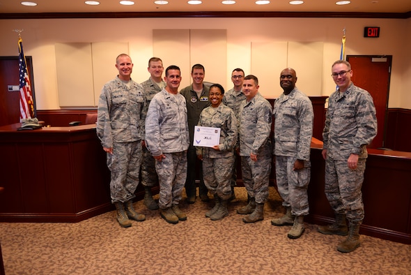 Capt. Tiffany Sykes, 47th Flying Training Wing assistant staff judge advocate, was chosen by wing leadership to be the “XLer” of the week, for the week of Sept. 4, 2018, at Laughlin Air Force Base, Texas. The “XLer” award, presented by Col. Charlie Velino, 47th Flying Training Wing commander, is given to those who consistently make outstanding contributions to their unit and the Laughlin mission. (U.S. Air Force photo by Senior Airman Benjamin N. Valmoja)