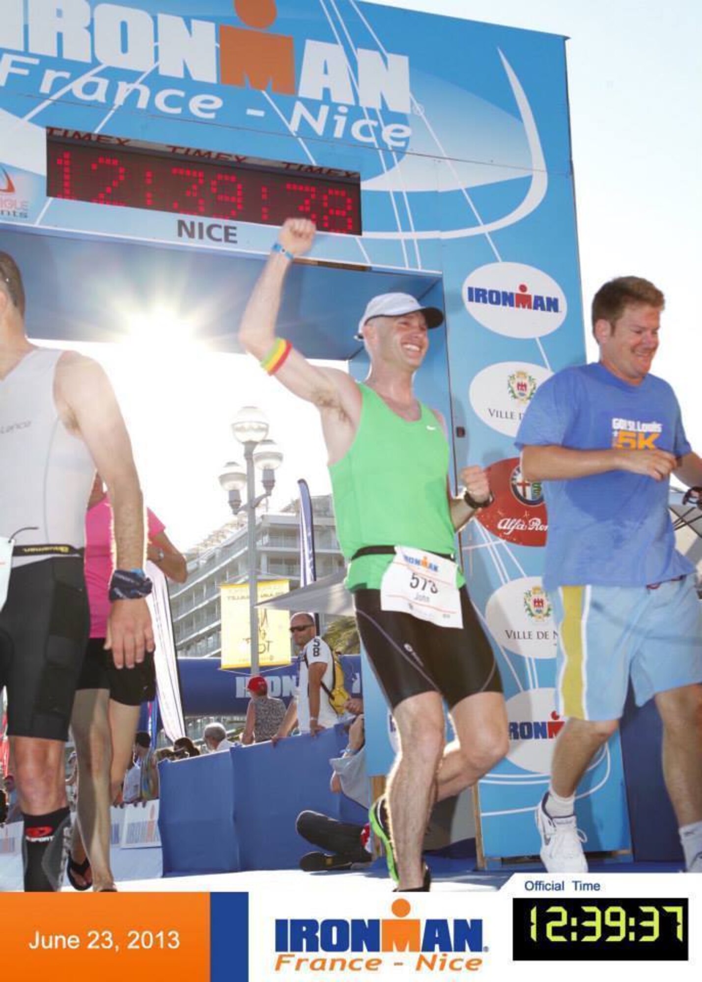 Lt. Col. John Berger crosses the finish line June 23, 2013 after completing an Ironman competition in Nice, France. Berger completed the competition a year after being hit by a truck. (Courtesy Photo)