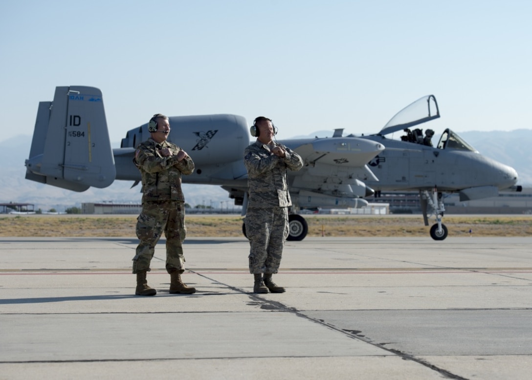 Army Brig. Gen. Michael J. Garshak, the adjutant general of Idaho and commander of the Idaho National Guard, shadows Air Force Staff Sgt. Jeremy Johnson, a 124th Aircraft Maintenance Squadron crew chief, while he prepares to launch an A-10 Thunderbolt II assigned to the 190th Fighter Squadron at Gowen Field, Boise, Idaho.