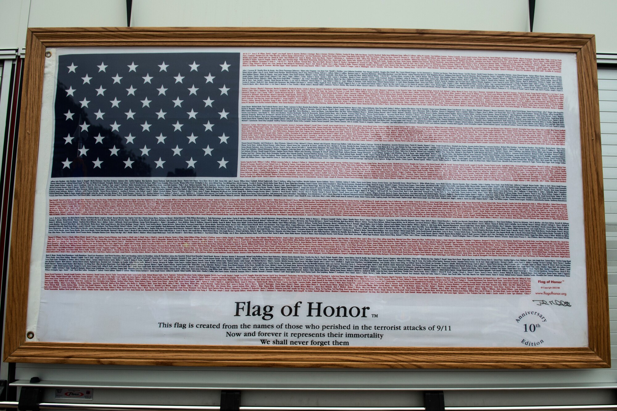 A flag with the names of all the victims of the attacks on Sept 11, 2001 is displayed during the 9/11 Remembrance ceremony, Sept. 11, 2018, at Altus Air Force Base, Okla. The flag belongs to Philip Fourroux, the fire chief at the 97th Civil Engineer Squadron, and was given to him several years ago in remembrance of the attacks.