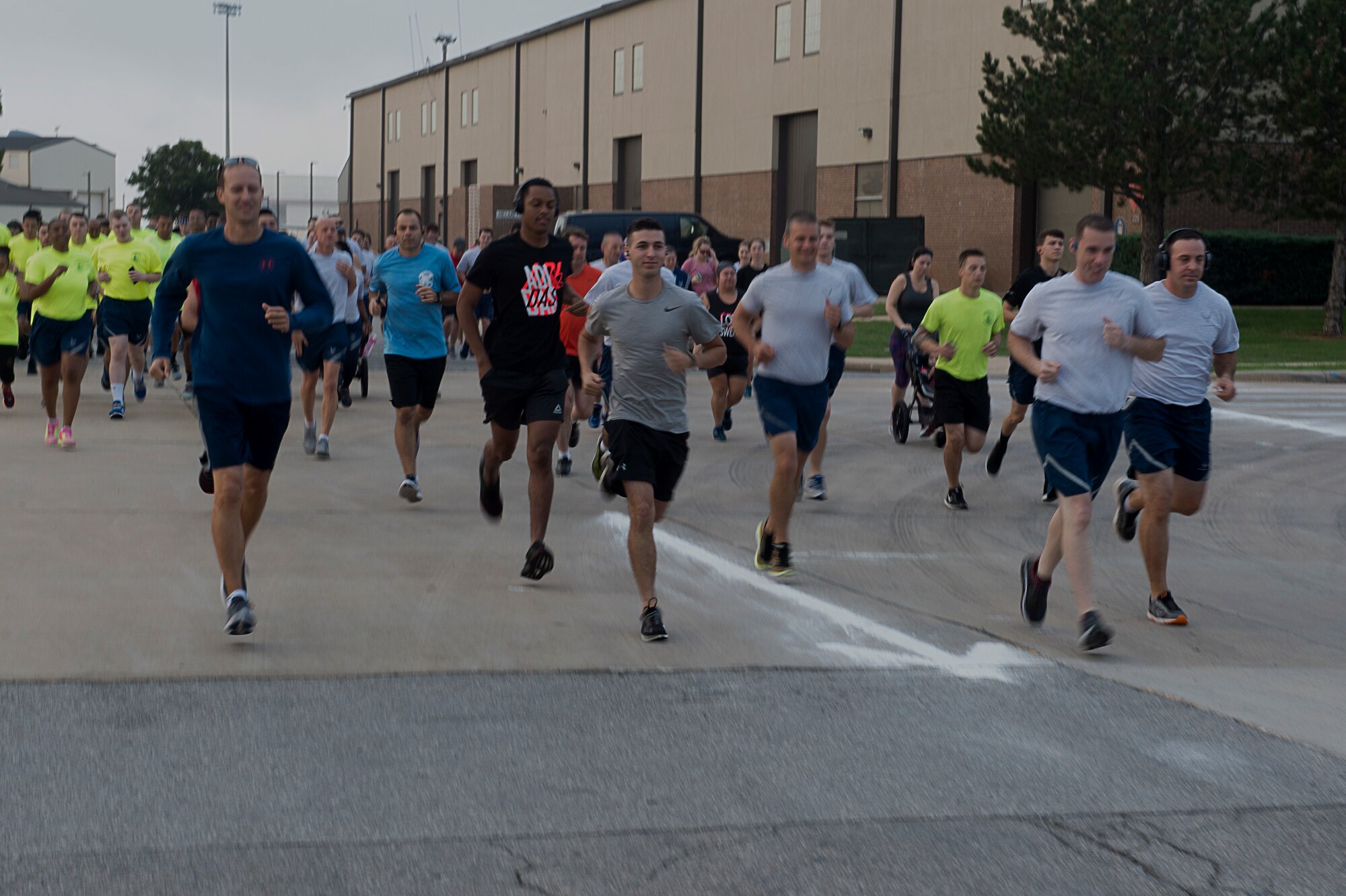 Members from the 97th Air Mobility Wing run after the 9/11 Remembrance ceremony, Sept. 11, 2018, at Altus Air Force Base, Okla. The memorial run was held in remembrance of the people who lost their lives during the attacks on Sept. 11, 2001.
