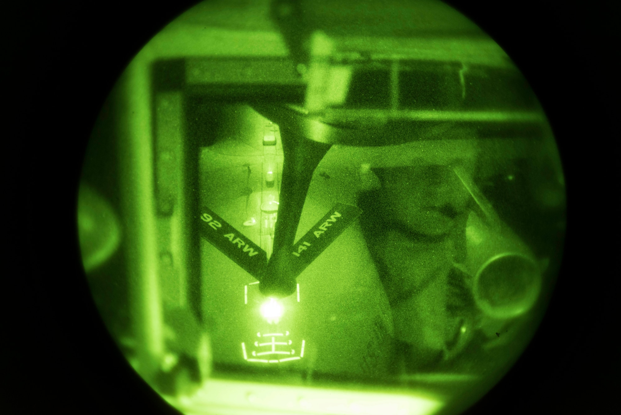A C17 Globemaster III takes part in a night refueling operation with a KC-135 Stratotanker from the 92nd Air Refueling Wing over northern Oregon Oct. 19, 2016. Most aircraft that can perform mid-air refueling have strategically placed lights and reflectors to help a boom operator line-up a connection. (U.S. Air Force photo/ Airman 1st Class Ryan Lackey)