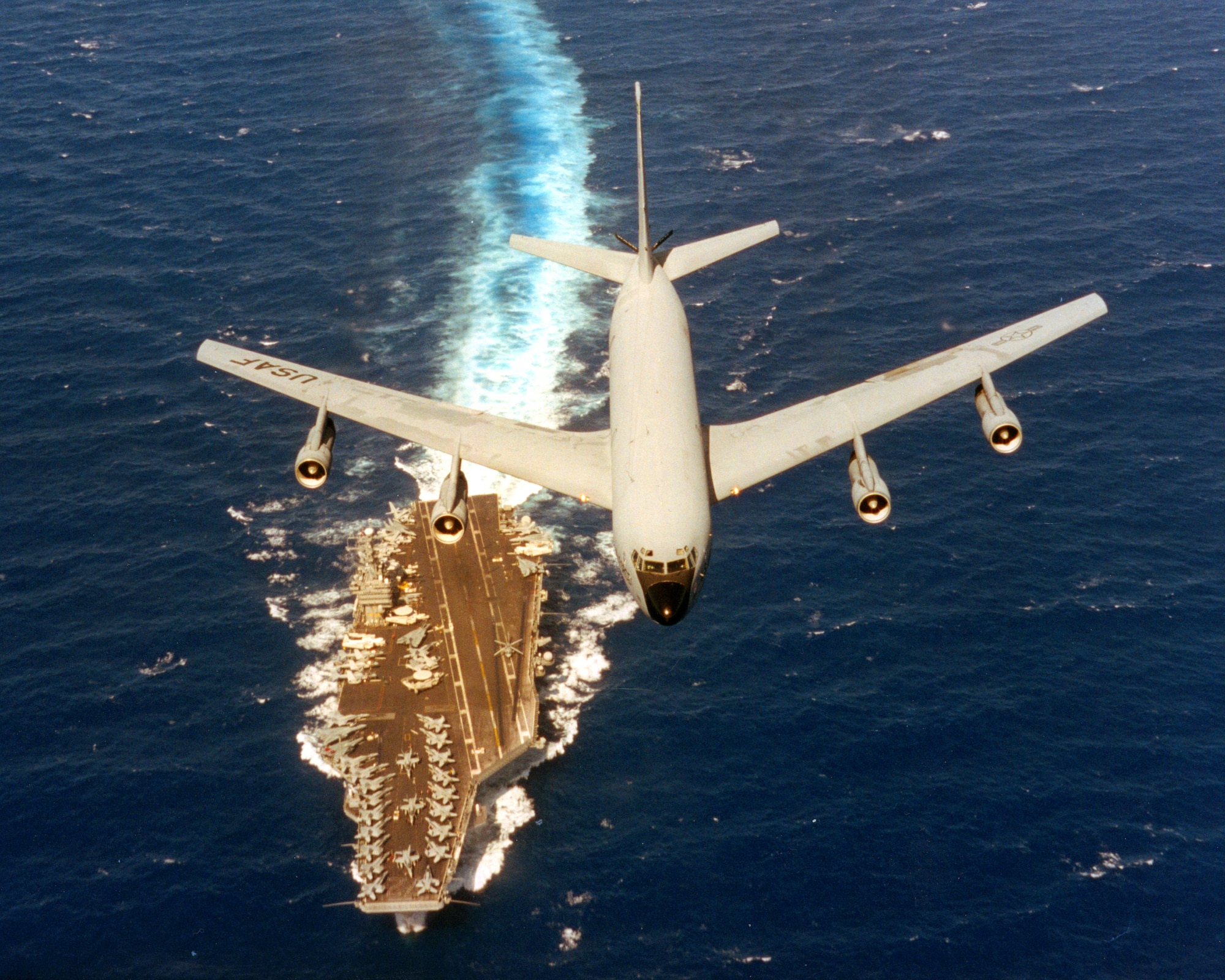 A 141st Air Refueling Wing KC-135 flies over the USS Abraham Lincoln during a RIMPAC exercise June 2-19, 2000. (U.S. Air Force courtesy photo)