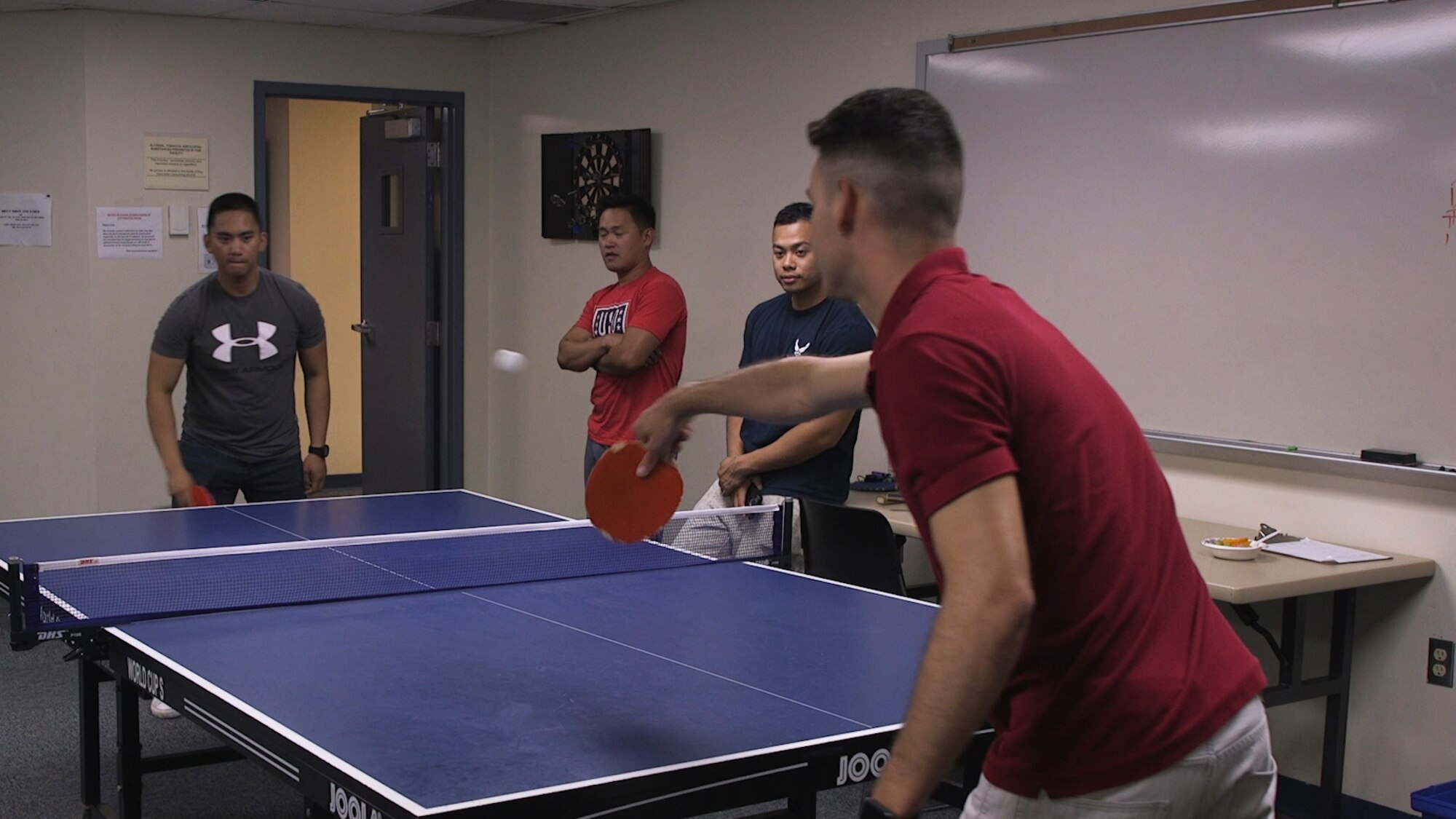 U.S. Air Force Airmen assigned to the 97th Air Mobility Wing play ping pong at the Airman Ministry Center, Sep. 6, 2018 at Altus Air Force Base, Okla. The Airman Ministry Center offers multiple forms of entertainment for Airmen to come enjoy on the weekends.