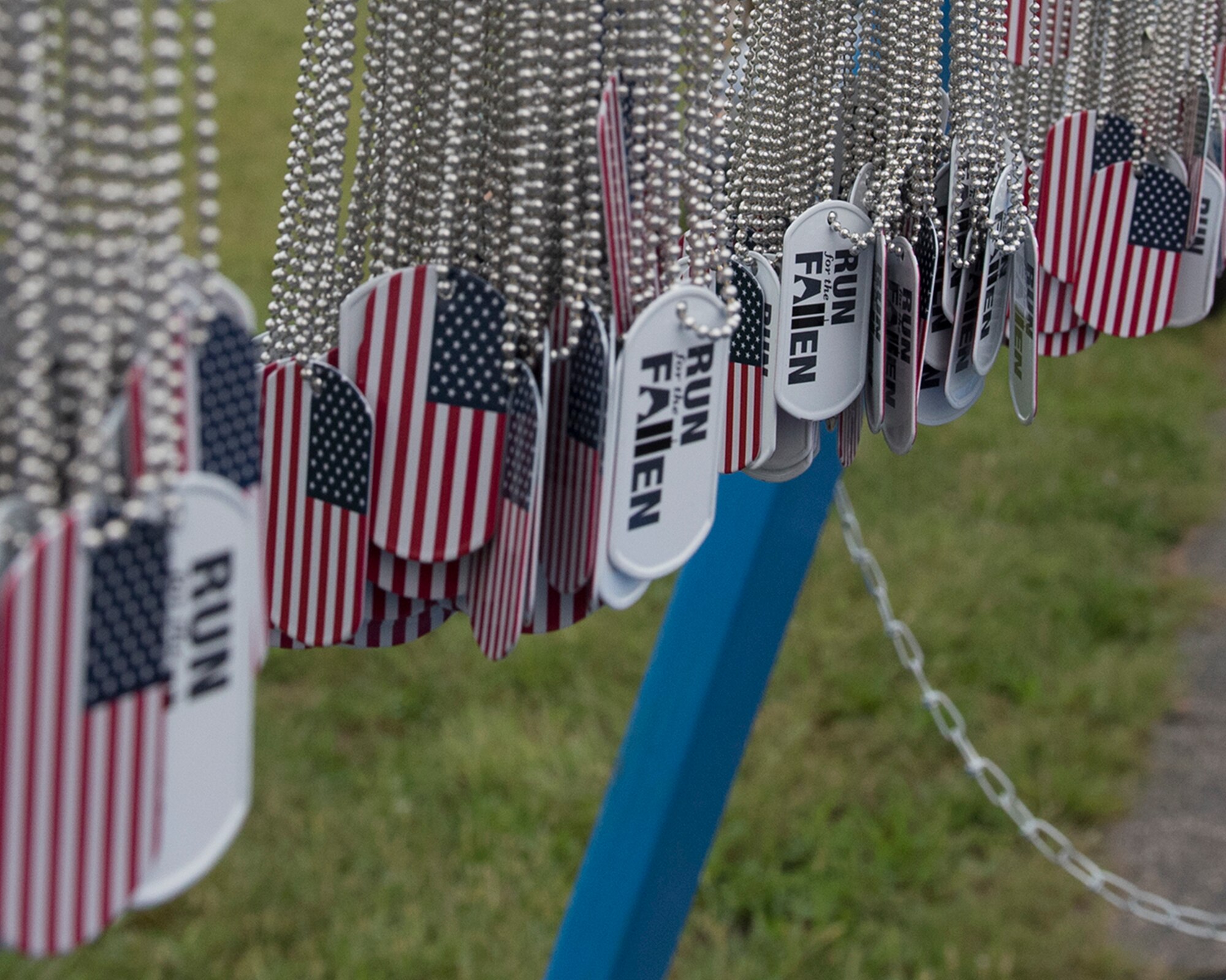 Run for the Fallen medallions hang from a stand at Wright-Patterson Air Force Base, Ohio, Sept. 11, 2018. The medallions were given to runners to mark the 17th anniversary of the 9/11 terrorist attacks. (U.S. Air Force photo by Michelle Gigante)