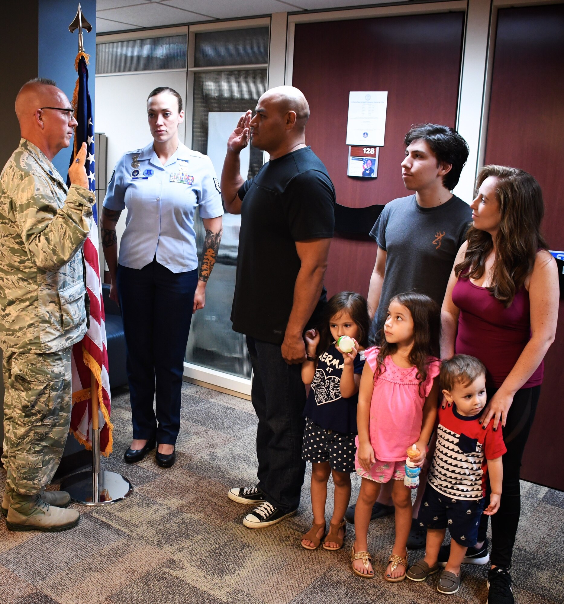 Family showed up to witness Lt. Col. Stan Paregien perform the oath of enlistment for Bernard Collins, as his recruiting specialist, Tech Sgt. Brittany Paus looks on in background.

"This is my WHY...Today is proof... When you Fight the Good Fight for others... The ripple of victory does follow," said 932nd Airlift Wing recruiter Tech Sgt. Brittany Paus.

This veteran and his family patiently trusted the administrative process, which took about two years from when they started his application.

"I am so grateful to welcome back Tech Sgt Collins and his family to service!  Every enlistment means a great deal, being a small vessel towards life changing chapters.  Moments like these, simply reinforce the humble honor the role of 'Recruiter' truly is," Paus added.

Congratulations Tech. Sgt. Brittany Paus on her background work on behalf of Sergeant Collins and the Collins Family as he starts his next chapter as a Citizen Airman and Air Reserve Technician in the maintenance world!

(U.S. Air Force photo by Senior Master Sgt. Melissa Melichar)