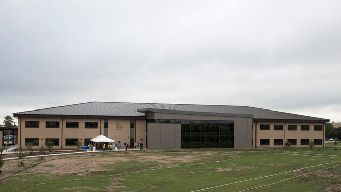 The 59th Medical Wing celebrated the opening of the new Reid Health Services Center facility with a ribbon cutting ceremony Sept. 13 on Joint Base San Antonio-Lackland, Texas. The new Reid Clinic incorporates functions from four buildings into one, consisting of 19 departments, and will serve approximately 86,000 patients per year. (U.S. Air Force photo by Staff Sgt. Kevin Iinuma)