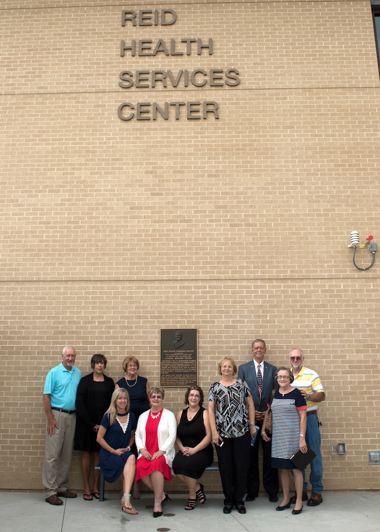 Family members of the late Senior Master Sgt. David B. Reid pose for a photo after the Sep. 13 ribbon cutting ceremony at the new Reid Health Services Center on Joint Base San Antonio-Lackland, Texas. The clinic was named in honor of Reid who was killed in a C-130 plane crash en route to Honduras in 1985. (U.S. Air Force photo by Staff Sgt. Kevin Iinuma)