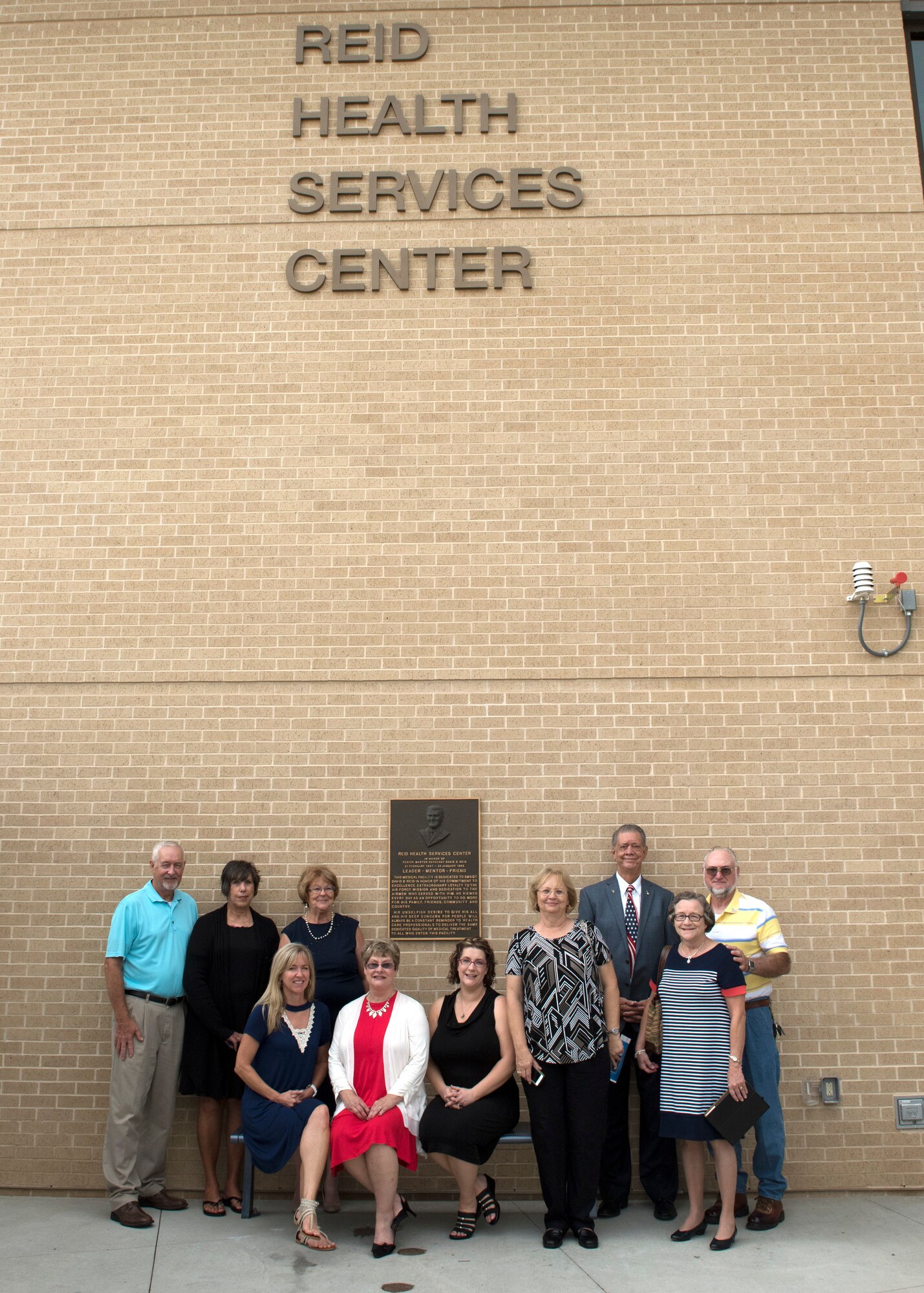 Family members of the late Senior Master Sgt. David B. Reid pose for a photo after the Sep. 13 ribbon cutting ceremony at the new Reid Health Services Center on Joint Base San Antonio-Lackland, Texas. The clinic was named in honor of Reid who was killed in a C-130 plane crash en route to Honduras in 1985. (U.S. Air Force photo by Staff Sgt. Kevin Iinuma)
