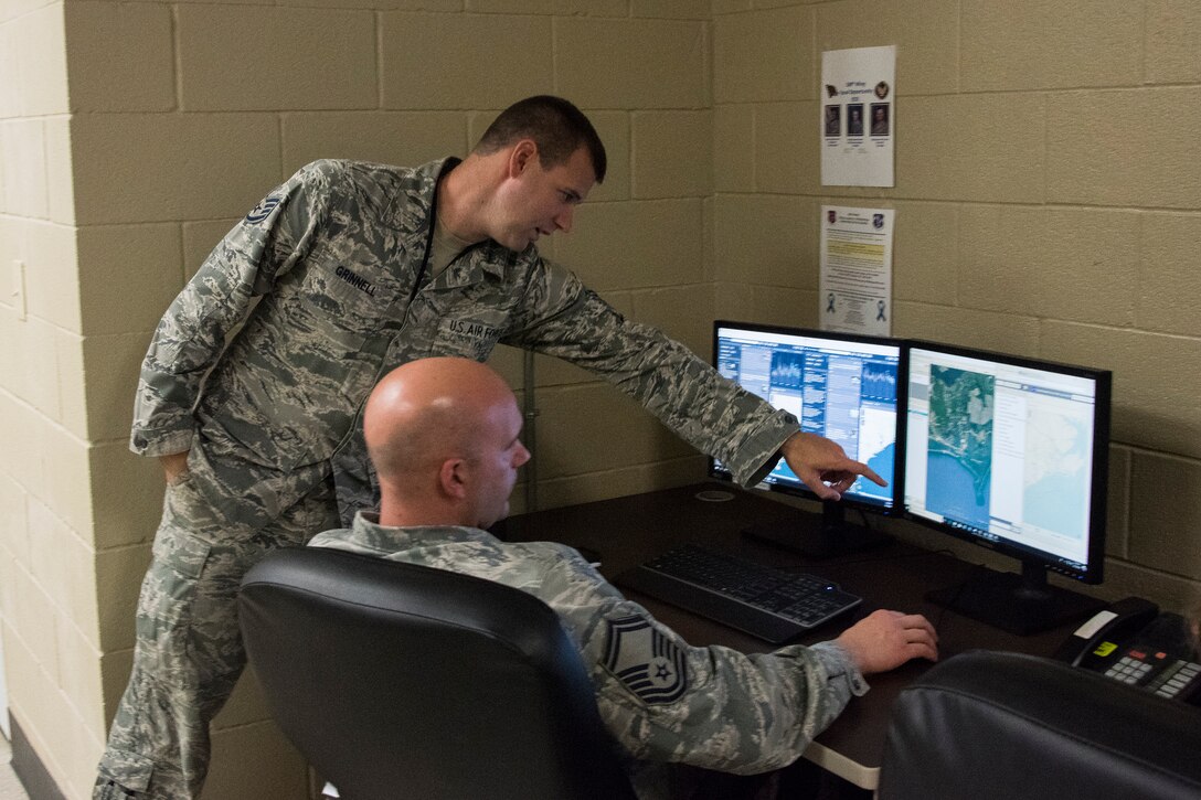 188th Wing intelligence analysts create graphical information products in the 188th Unclassified Processing, Assessment, and Dissemination element at Ebbing Air National Guard Base, Ark., in support of Hurricane Florence responders, Sept. 13, 2013. The UPAD rapidly provides graphical information products requested by incident commanders located across the storm’s path. (U.S. Air National Guard photo by Tech. Sgt. John E. Hillier)