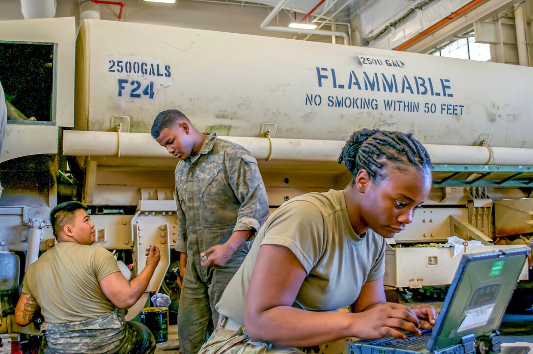 Soldiers prepare equipment for emergency deployment.