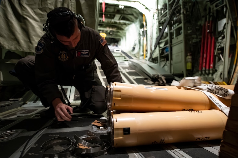 U.S. Air Force Reserve Master Sgt. Tom Barnaby, 53rd Weather Reconnaissance Squadron loadmaster, prepares Airborne Expendable Bathythermographs  for a mission into Hurricane Florence Sept. 12, 2018. The buoys are released from a flare launch tube during flight to measure oceanic conditions, which provides information for forecasts. (U.S. Air Force Photo by Tech. Sgt. Chris Hibben)