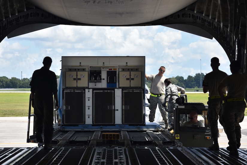 Airmen assigned to the 437th Aerial Port Squadron and 16th Airlift Squadron load a portable lavatory onto a C-17 Globemaster III at Joint Base Charleston, S.C., Sept. 11, 2018.