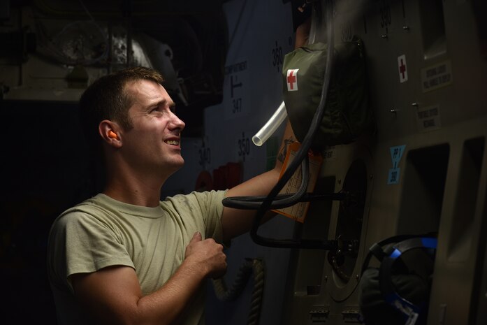 Airman 1st Class Sean McGrath, a 437th Aircraft Maintenance Squadron aerospace maintainer, installs hoses for a portable lavatory inside a C-17 Globemaster III at Joint Base Charleston, S.C., Sept. 11, 2018.