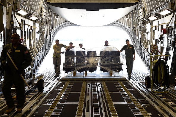 Airmen assigned to the 437th Airlift Wing load airplane seats onto a C-17 Globemaster III at Joint Base Charleston, S.C., Sept. 11, 2018.