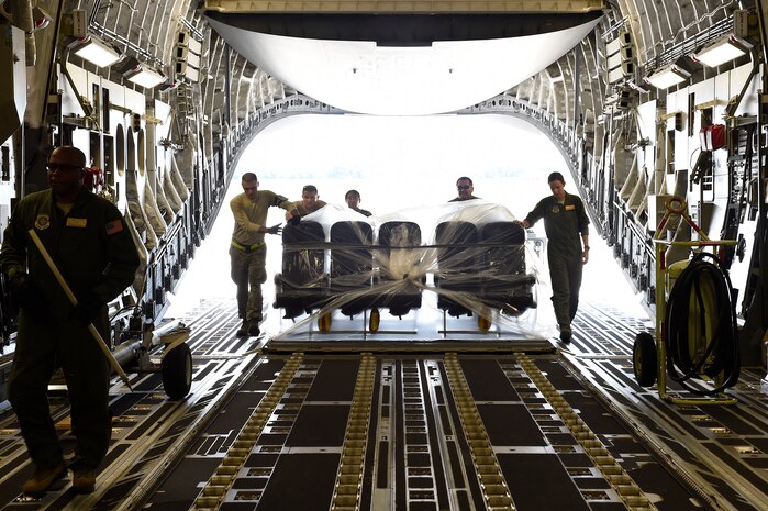 Airmen assigned to the 437th Airlift Wing load airplane seats onto a C-17 Globemaster III at Joint Base Charleston, S.C., Sept. 11, 2018.