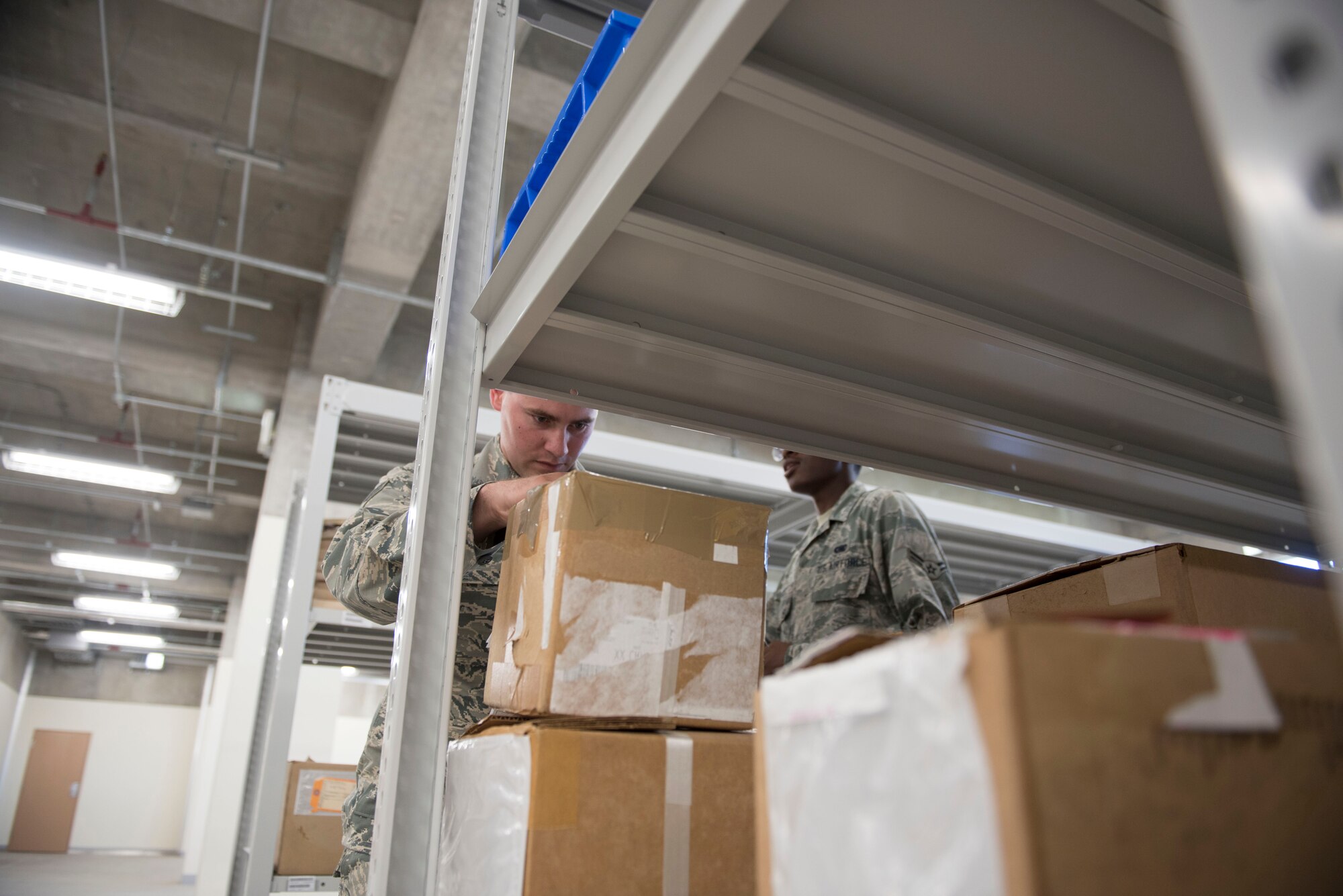 A member of the 919th Special Operations Logistics Readiness Squadron from Duke Field, Fla., checks a package as part of training with the 18th Logistics Readiness Squadron Sept. 12, 2018, at Kadena Air Base, Japan. The 919th SOLRS spent more than five days with the 18th LRS, training to familiarize themselves with the higher operational tempo that Kadena AB experiences on a regular basis.