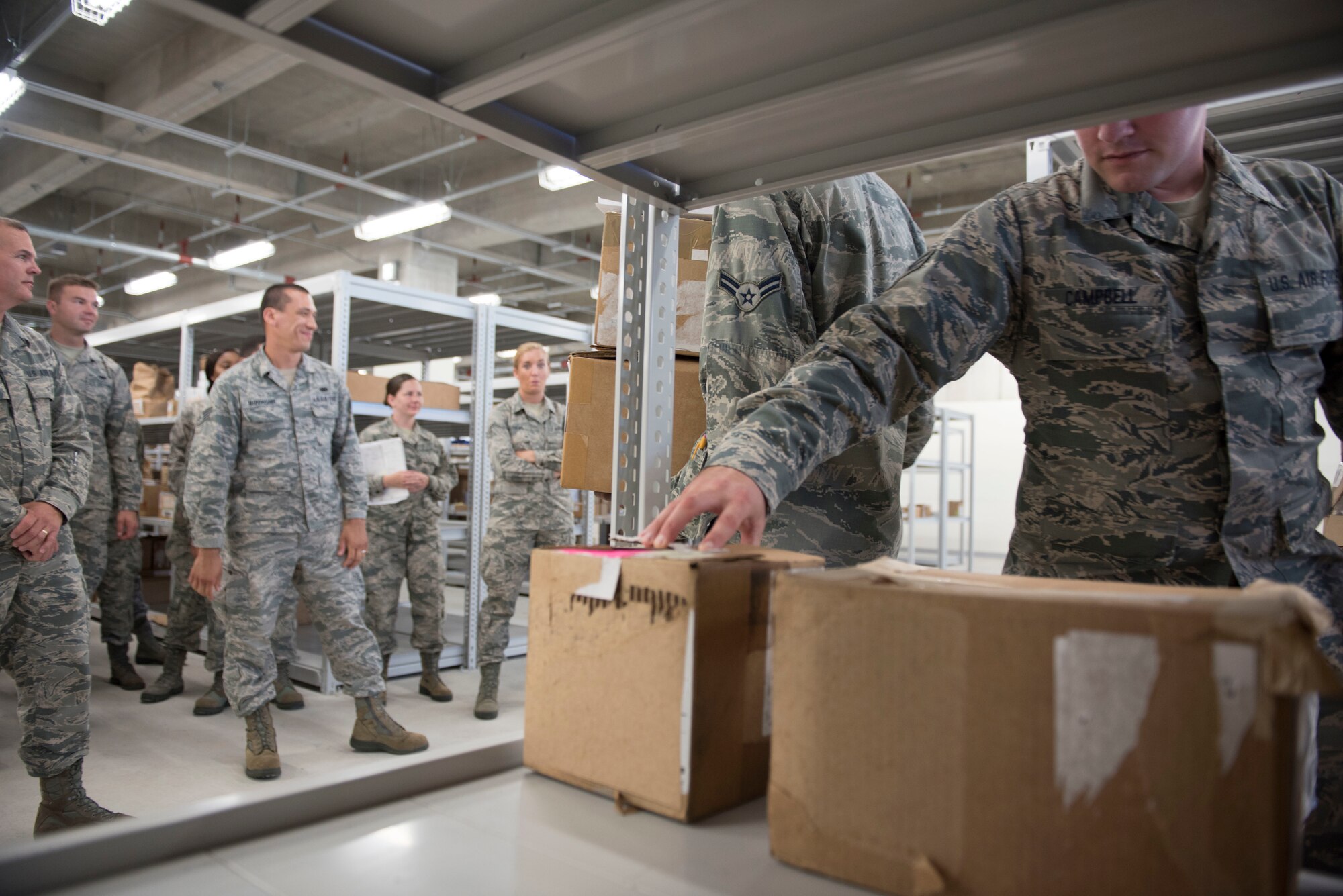 A member of the 919th Special Operations Logistics Readiness Squadron from Duke Field, Fla., checks a package as part of training with the 18th Logistics Readiness Squadron Sept. 12, 2018, at Kadena Air Base, Japan. Each base within the Air Force has its own tempo. Smaller units with fewer operational requirements may train with larger, busier units to prepare for potential deployments or increases in their home-stations demands.