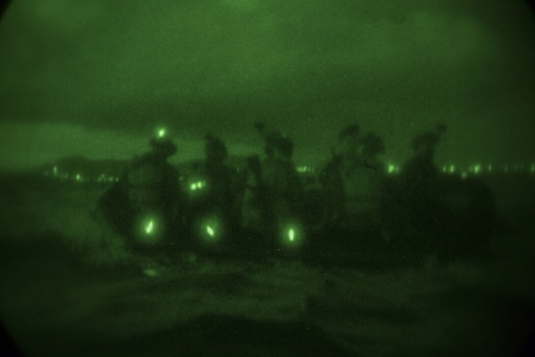 Marines with the 31st Marine Expeditionary Unit's Amphibious Reconnaissance Platoon ride a Combat Rubber Raiding Craft during a reconnaissance and surveillance training mission off the coast of Okinawa, Japan, Aug. 22, 2018.