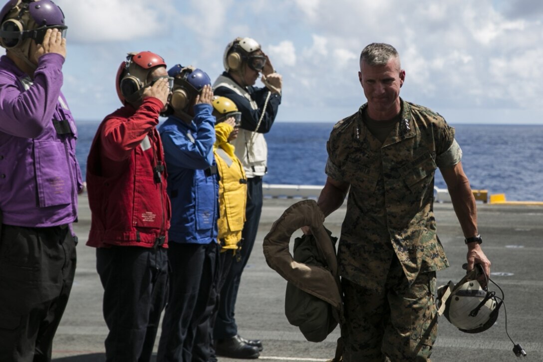 Lt. Gen. Eric Smith, III Marine Expeditionary Force commanding general, boards the amphibious assault ship USS Wasp (LHD 1), while underway off the coast of Okinawa, Japan, Aug. 27, 2018.
