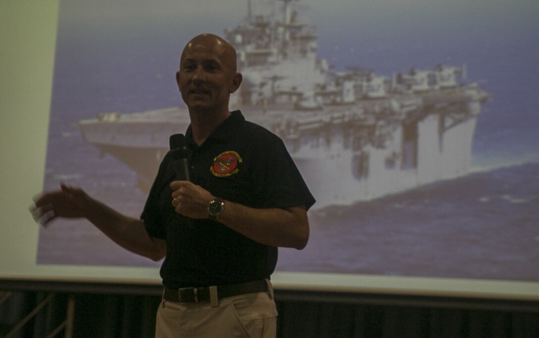 Col. Robert Brodie, commanding officer of the 31st Marine Expeditionary Unit, speaks to Marines, Sailors and their families during a pre-deployment brief at Camp Shields, Okinawa, Japan, July 31, 2018.