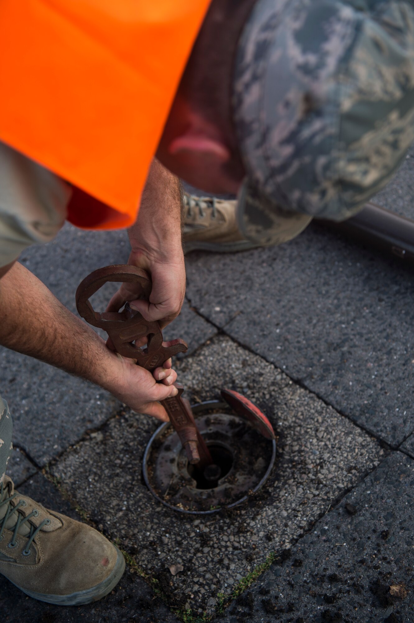 U.S. Staff Sgt. Adam Recob, 52nd Civil Engineer Squadron Pavement and Construction equipment operator, prepares to place a roadway barrier pole at Spangdahlem Air Base, Germany, Sept. 10, 2018, during a base-wide readiness exercise. The week-long exercise required Airmen to respond quickly to simulated threats in preparation for potential real-life events. (U.S. Air Force photo by Airman 1st Class Valerie Seelye)