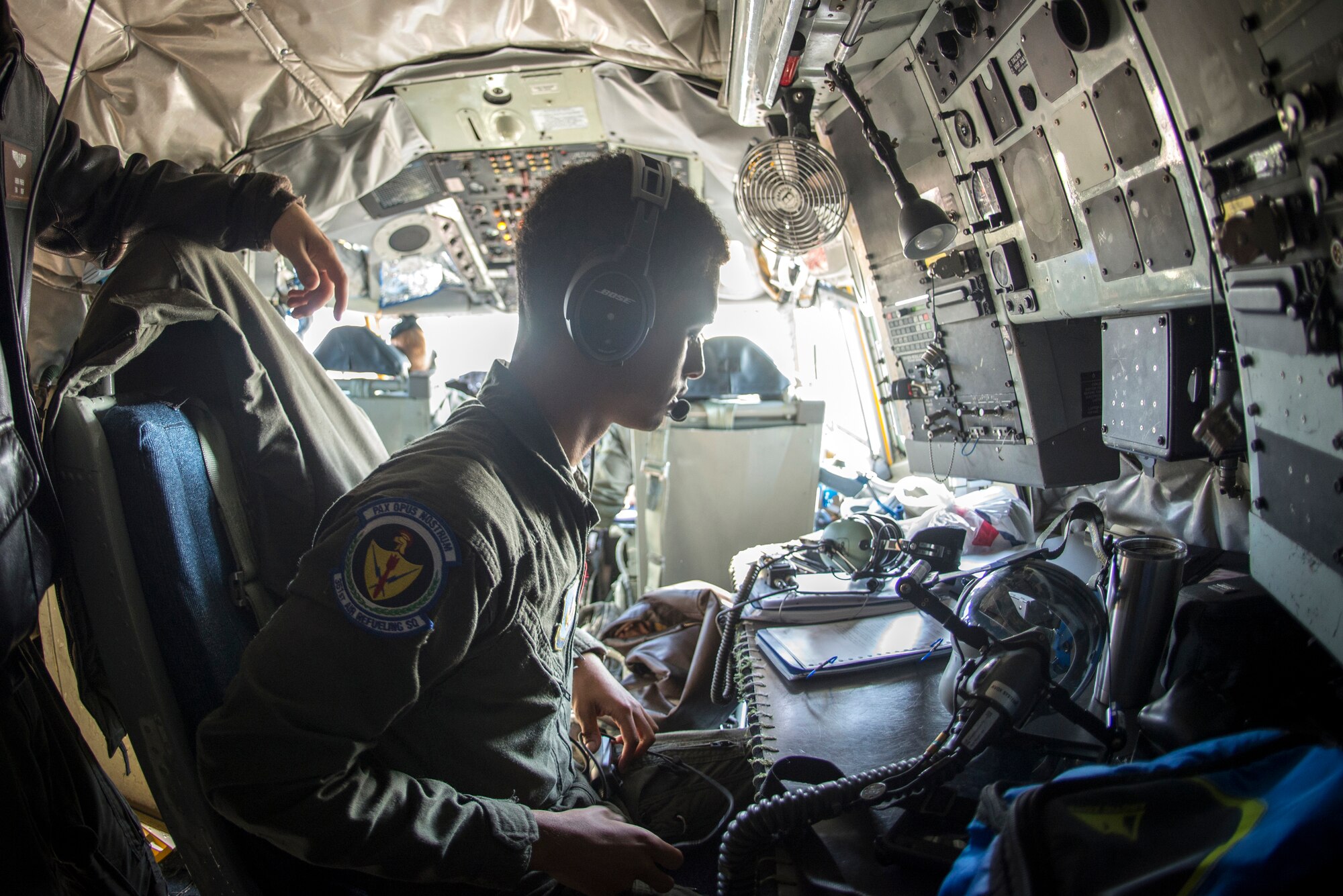 U.S. Air Force Airman 1st Class Noah Ford, 351st Air Refueling Squadron boom operator, reads over a checklist to prepare for take-off aboard a KC-135 Stratotanker prior to a flight at RAF Mildenhall, England, Sept. 13, 2018. The 100th ARW supported training with a U.S. Air Force B-52 and Romanian Air Force F-16s in the airspace above Romania. (U.S. Air Force photo by Tech. Sgt. Emerson Nuñez)