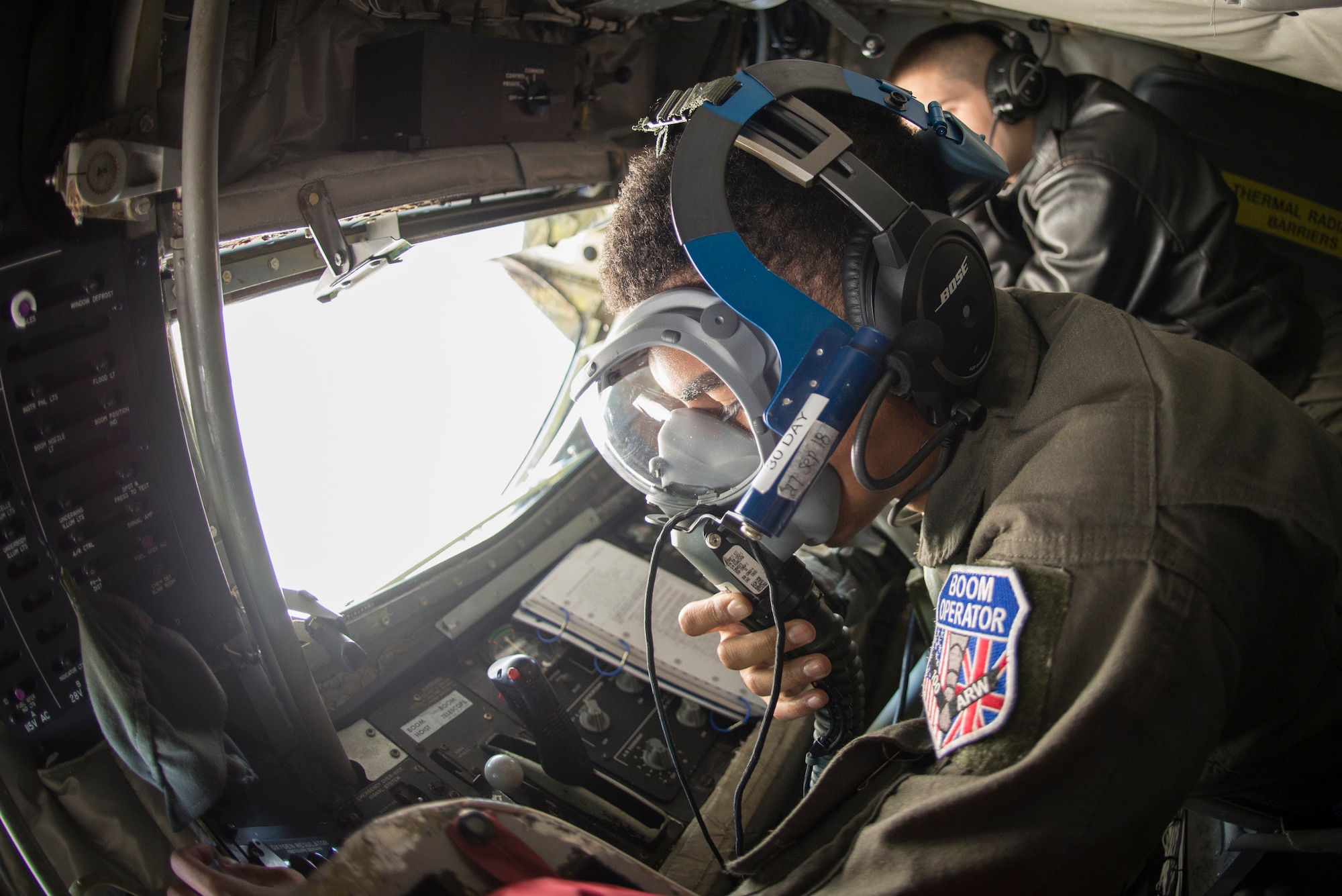 U.S. Air Force Airman 1st Class Noah Ford, 351st Air Refueling Squadron boom operator, tests an oxygen mask before take-off aboard a KC-135 Stratotanker prior to a flight at RAF Mildenhall, England, Sept. 13, 2018. The 100th ARW supported training with a U.S. Air Force B-52 and Romanian Air Force F-16s in the airspace above Romania.(U.S. Air Force photo by Tech. Sgt. Emerson Nuñez)