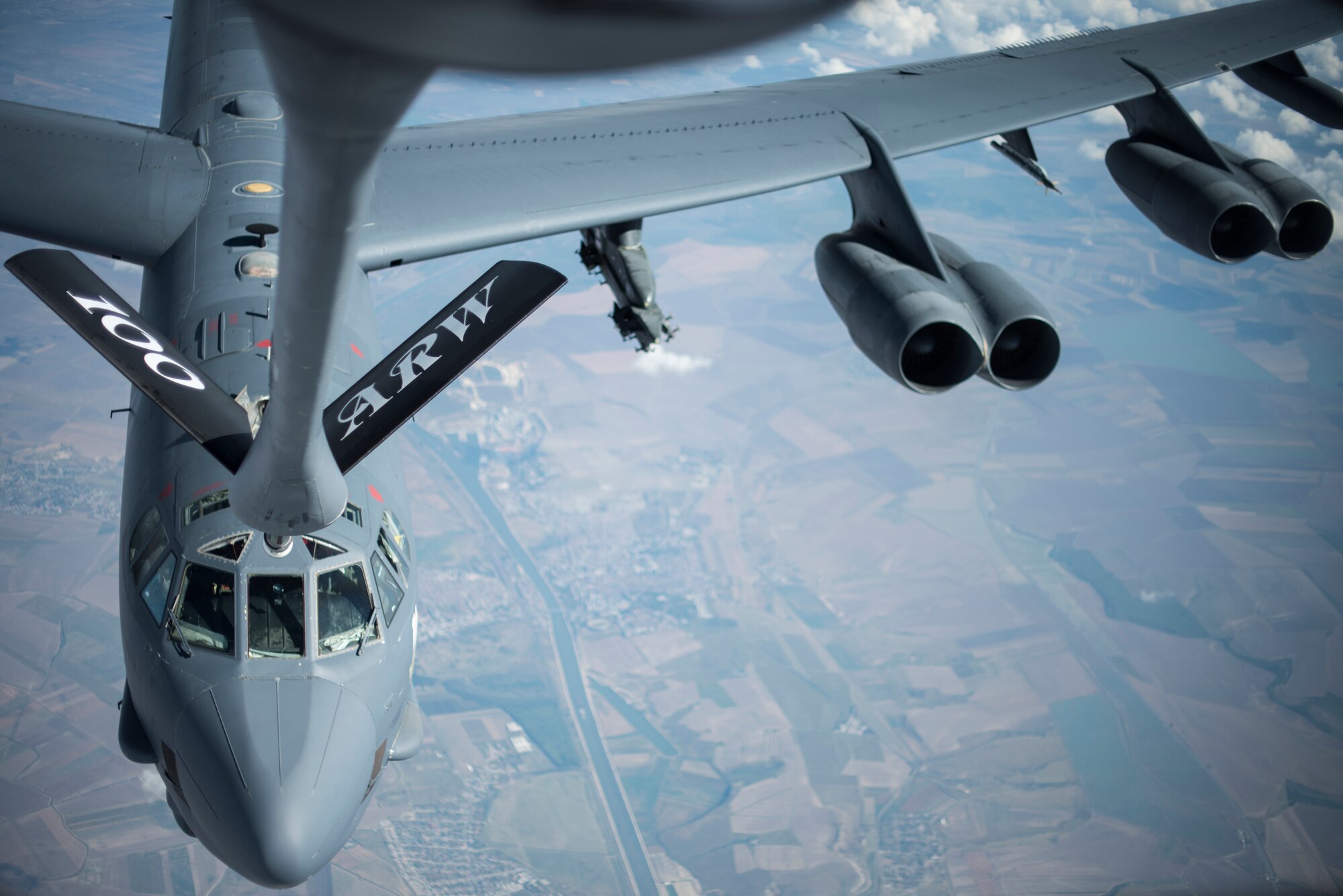 A U.S. Air Force B-52 Stratofortress recives fuel from a KC-135 Stratotanker from the 100th Air Refueling Wing, RAF Mildenhall, England, before receiving fuel over Romania Sept. 13, 2018. Training with NATO allies such Romania improves interoperability and demonstrates the United States’ commitment to regional security. (U.S. Air Force photo by Tech. Sgt. Emerson Nuñez)