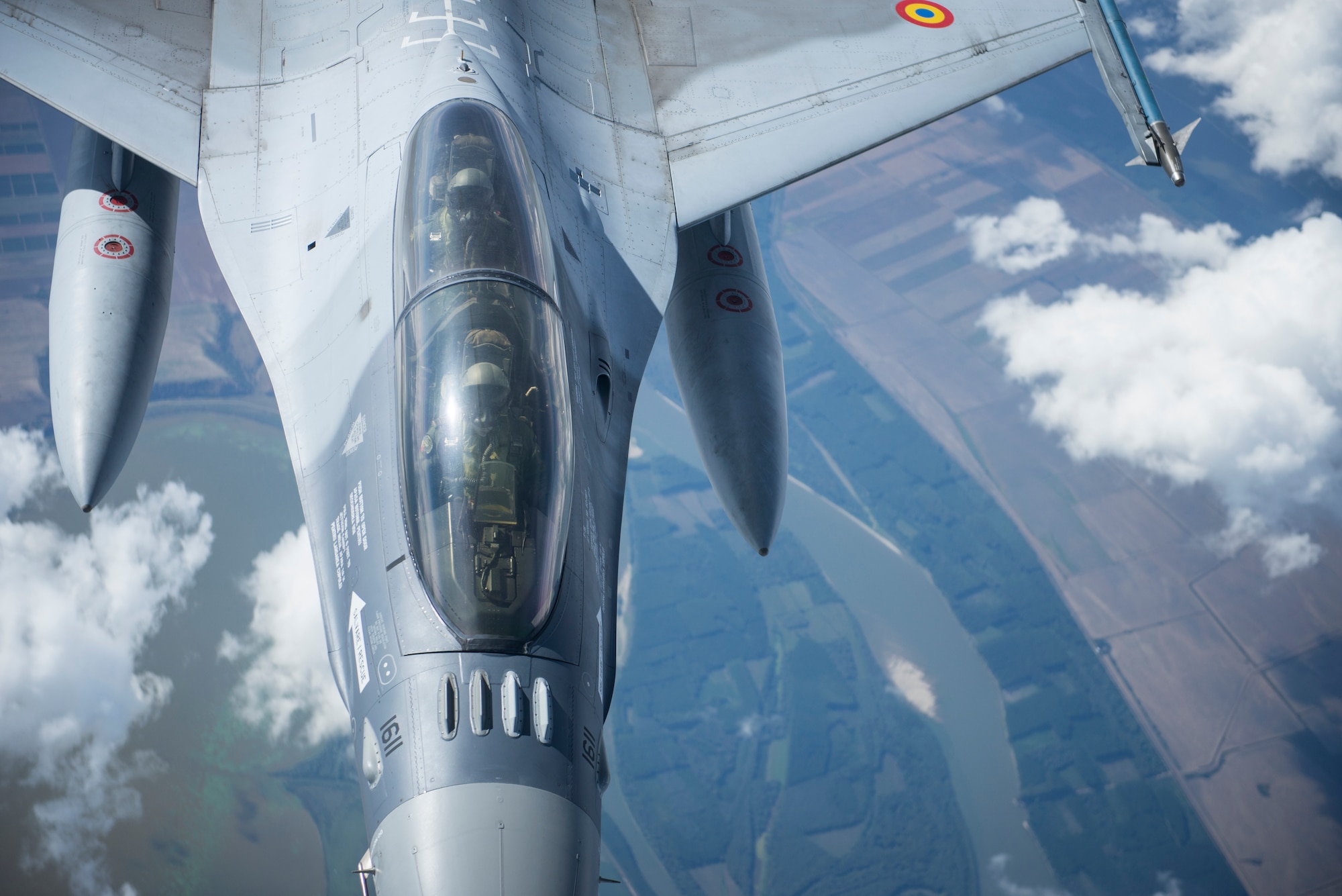 A Romanian Air Force F-16 prepares to recive fuel from a KC-135 Stratotanker from the 100th Air Refueling Wing, RAF Mildenhall, England, over Romania Sept. 13, 2018. Training with NATO allies such Romania improves interoperability and demonstrates the United States’ commitment to regional security. (U.S. Air Force photo by Tech. Sgt. Emerson Nuñez)