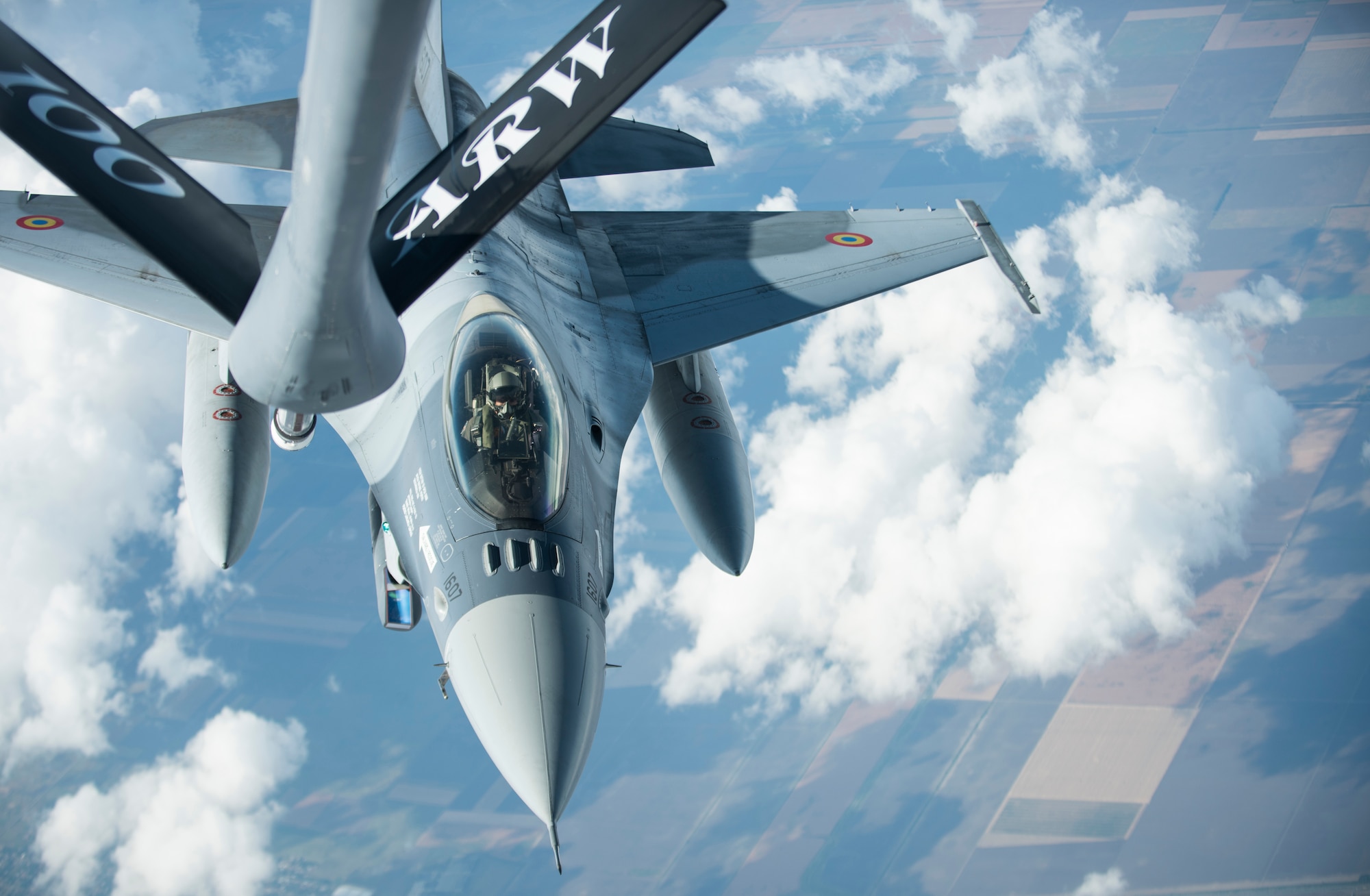 A Romanian Air Force F-16 prepares to receive fuel from a KC-135 Stratotanker from the 100th Air Refueling Wing, RAF Mildenhall, England, over Romania Sept. 13, 2018. Training with NATO allies such Romania improves interoperability and demonstrates the United States’ commitment to regional security. (U.S. Air Force photo by Tech. Sgt. Emerson Nuñez)