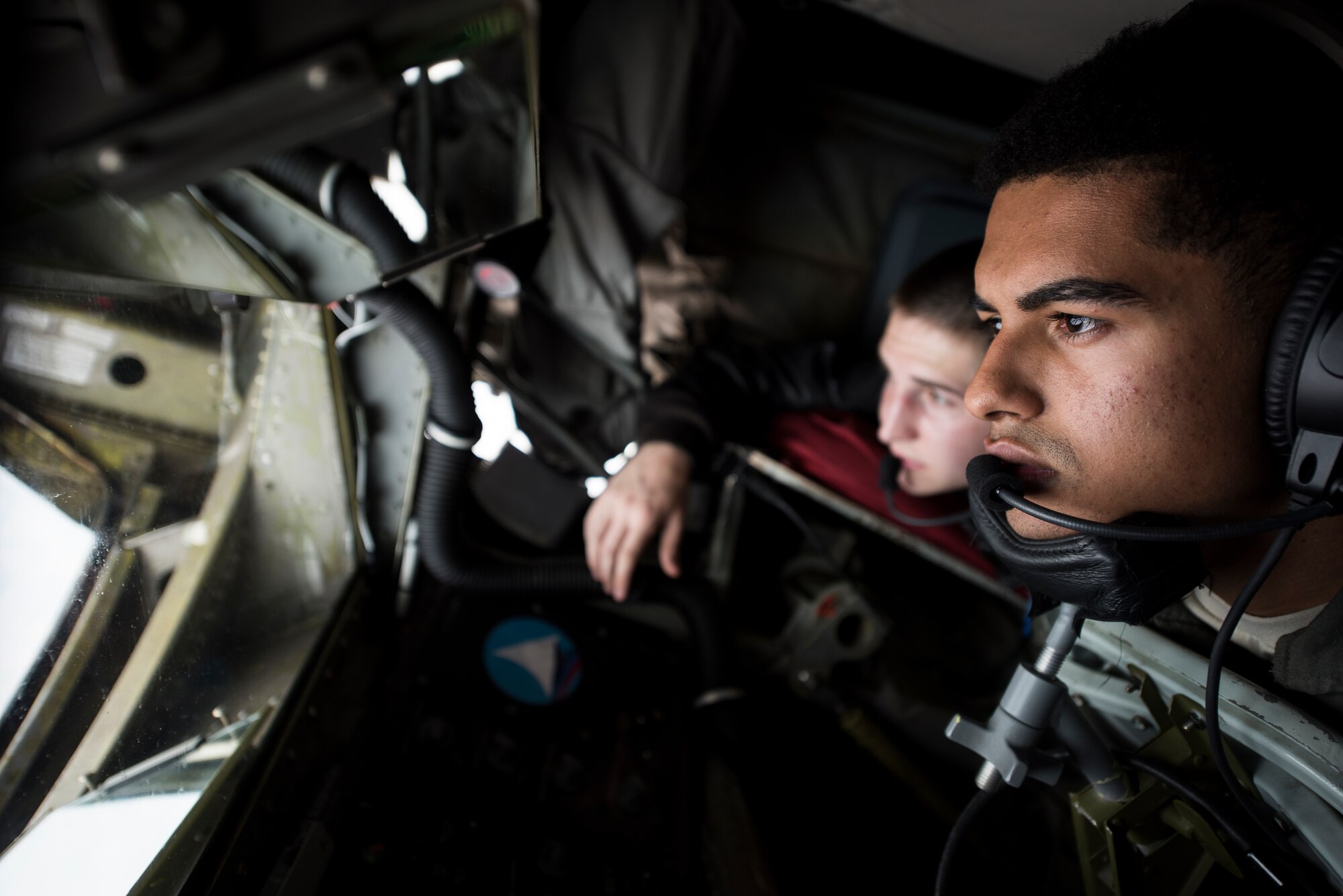 U.S. Air Force Airman 1st Class Noah Ford, 351st Air Refueling Squadron boom operator, re-fuels a Romanian Air Force F-16 over Romania Sept. 13, 2018. Training with NATO allies such as Romania improves interoperability and demonstrates the United States’ commitment to regional security.(U.S. Air Force photo by Tech. Sgt. Emerson Nuñez)