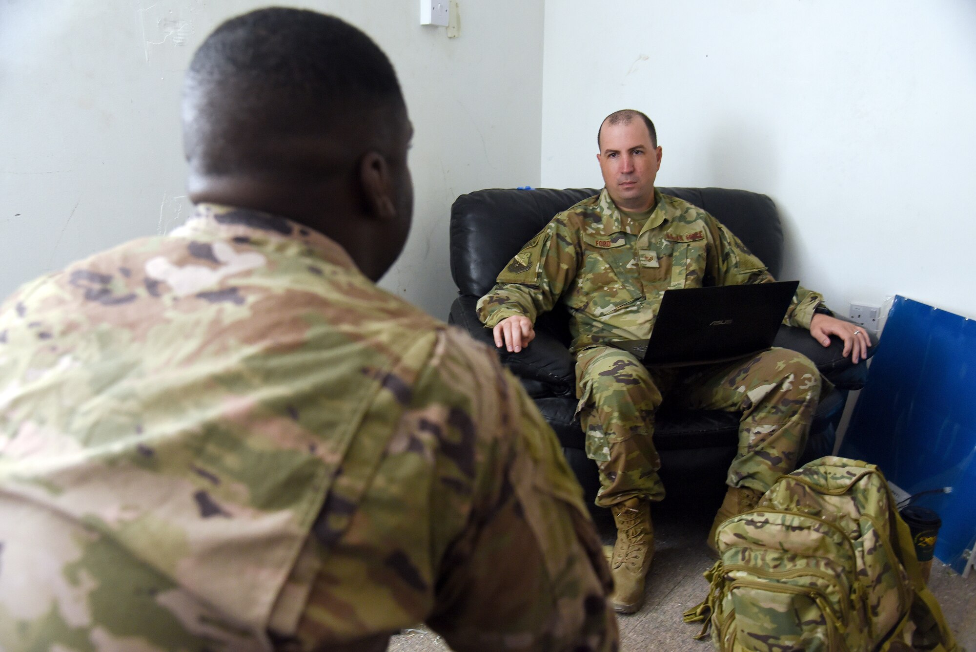 Staff Sgt. Christopher Ford, 379th Air Expeditionary Wing equal opportunity noncommissioned officer in charge, conducts a one-on-on interview with service members at Al Dhafra Air Base, United Arab Emirates, Sept. 10, 2018. The mission of EO includes enforcing a zero tolerance policy for unlawful discrimination as well as fostering positive human relations environments across squadrons, groups and wings.