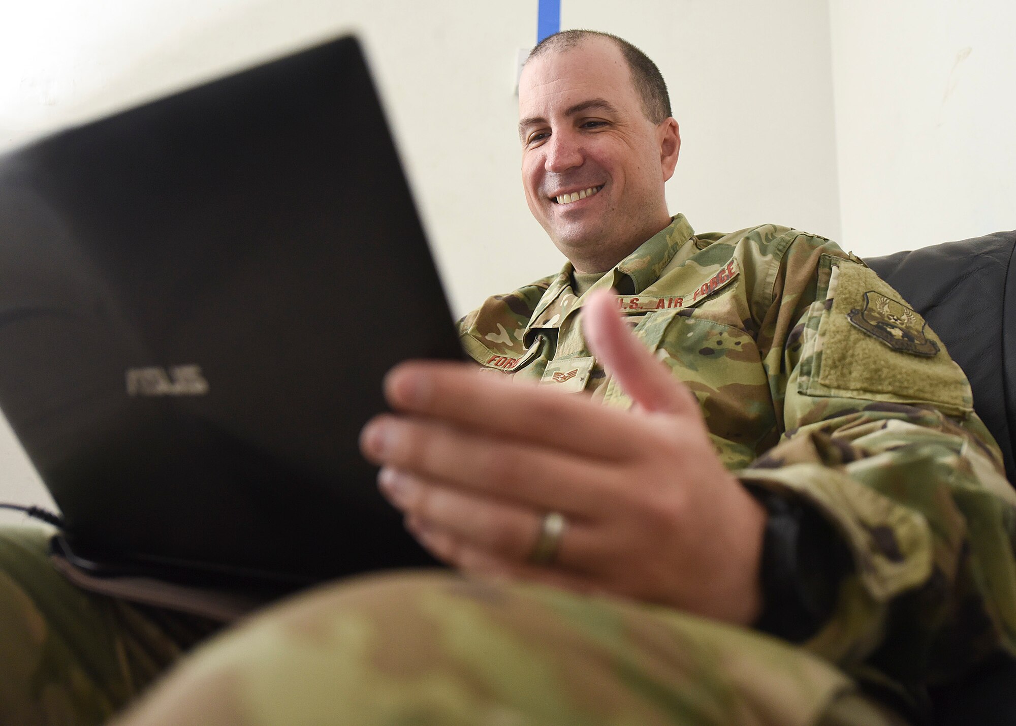 Staff Sgt. Christopher Ford, 379th Air Expeditionary Wing equal opportunity noncommissioned officer in charge, reviews information from a one-on-on interview with service members at Al Dhafra Air Base, United Arab Emirates, Sept. 10, 2018. The mission of EO includes enforcing a zero tolerance policy for unlawful discrimination as well as fostering positive human relations environments across squadrons, groups and wings.