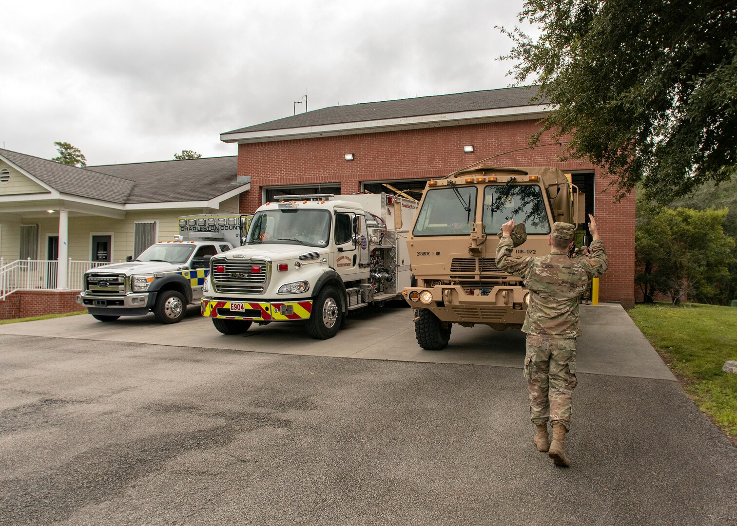 Soldiers with the 1-118th Infantry Battalion stage a Light Medium Tactical Vehicle (LMTV) at the McClellanville Fire Department ahead of Hurricane Florence, Sept. 13, 2018, McClellanville, South Carolina.  Approximately 2,100 Soldiers and Airmen have been mobilized to prepare, respond and participate in recovery efforts for Hurricane Florence.