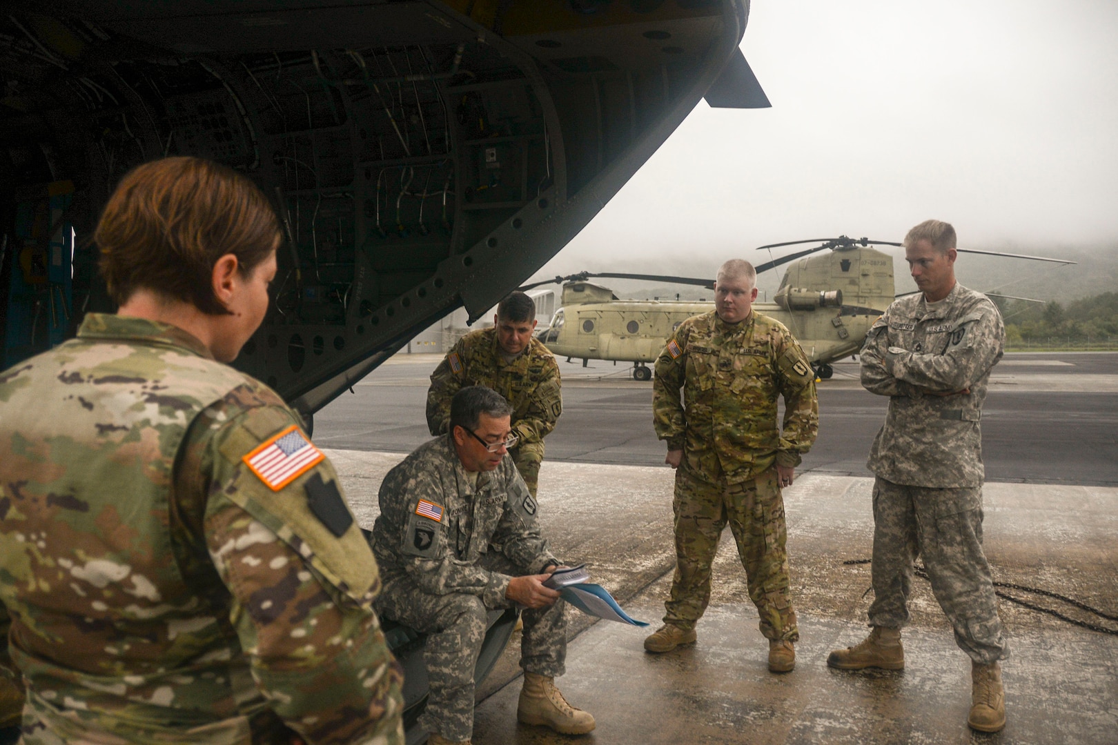 Chief Warrant Officer 4 Patrick Donohue, a CH-47 Chinook pilot with the Eastern Army Aviation Training Site (EAATS) briefs his crew before takeoff Sept. 13, 2018, from Muir Army Airfield at Fort Indiantown Gap, Pennsylvania. Approximately 25 Pennsylvania Guard members in two Chinooks and two UH-56 Black Hawk helicopters are bound for South Carolina in support of Hurricane Florence recovery efforts.