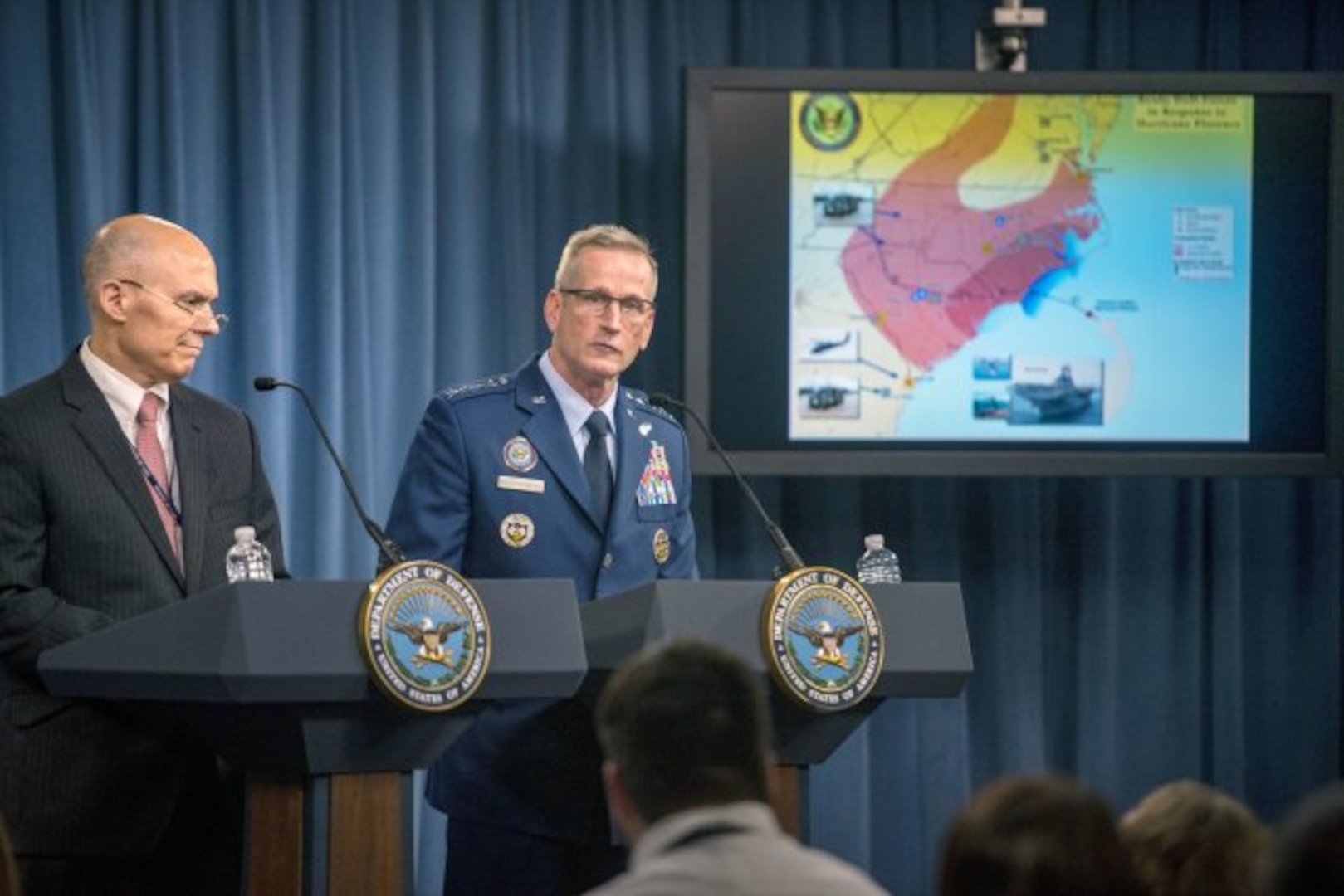 Kenneth P. Rapuano, left, assistant secretary of defense for homeland defense and global security, and Air Force Gen. Terrence J. O'Shaughnessy, commander of the North American Aerospace Defense Command and U.S. Northern Command, brief reporters at the Pentagon, Sept. 13, 2018, on Defense Department preparations for Hurricane Florence.